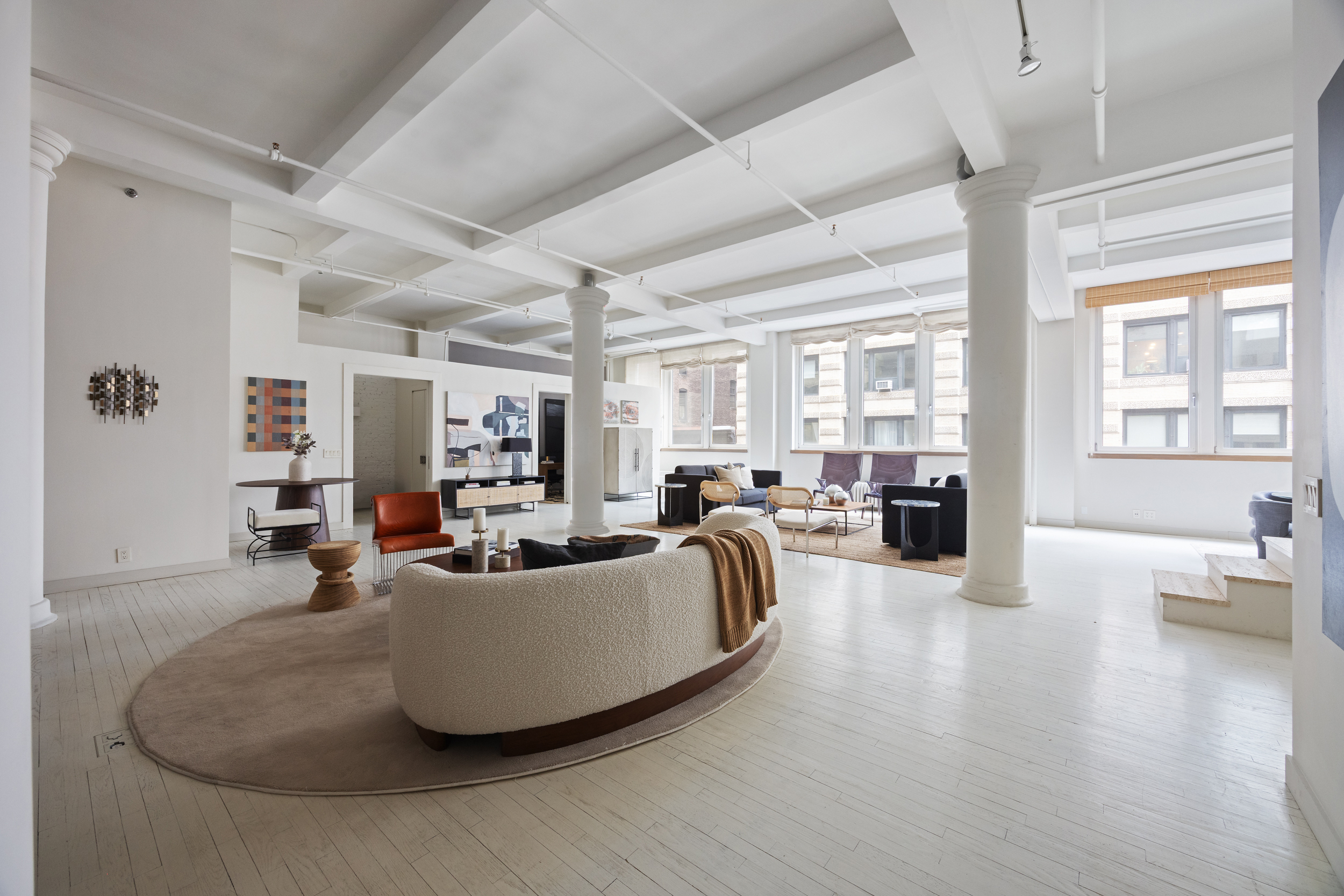 32 West 20th Street, Unit 5 Manhattan, NY 10011 - Photo 4 of 18 a living room with furniture and a large window
