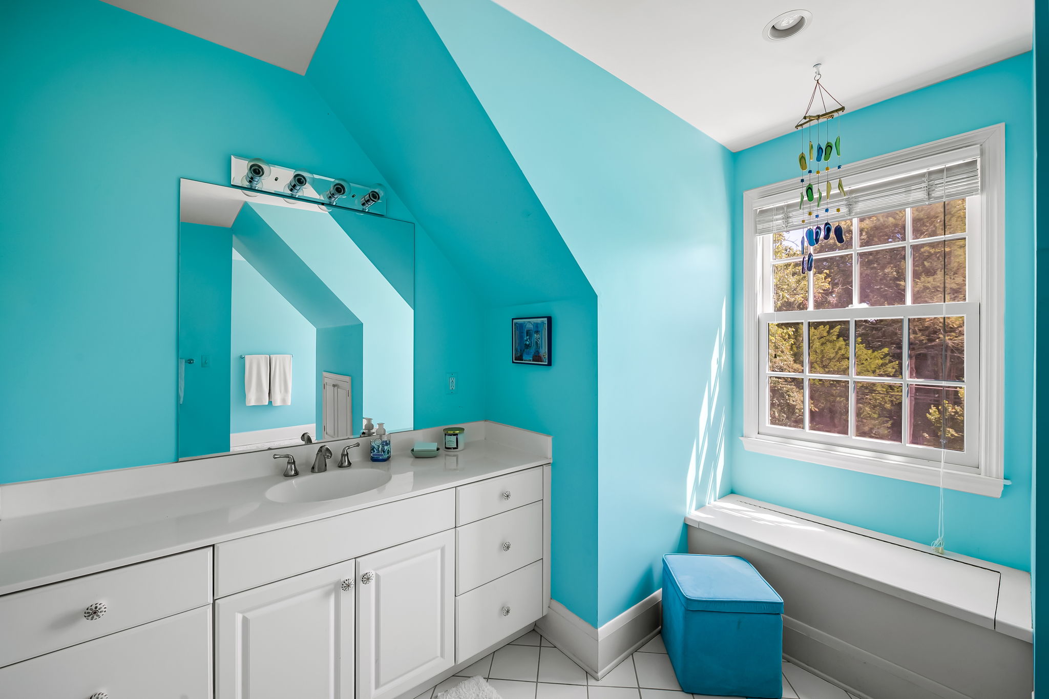 910 Army Road Towson, MD 21204 - Photo 44 of 62 a bathroom with a double vanity sink a mirror and a bathtub