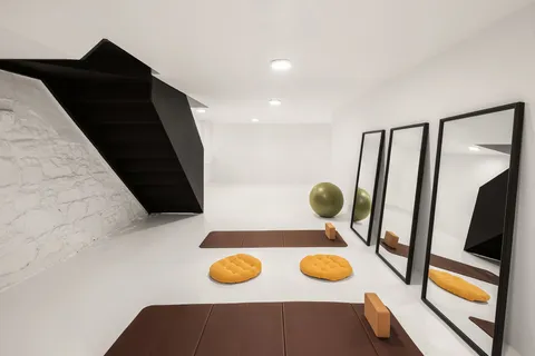 a living room with furniture and flat screen tv