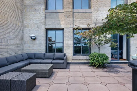 a view of a couches in the back yard of the house