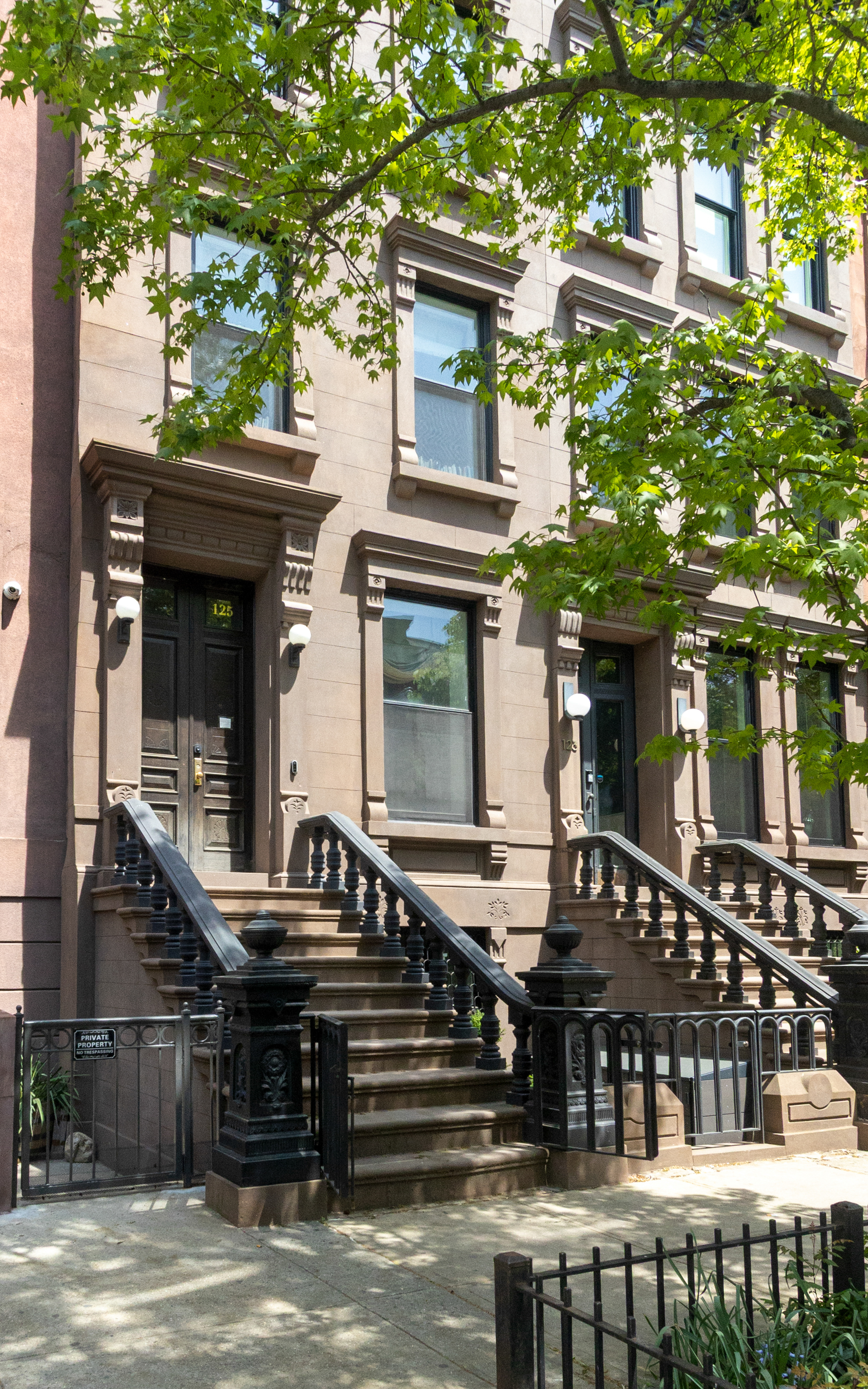 125 West 132nd Street Manhattan, NY 10027 - Photo 20 of 21 front view of a house with a small yard