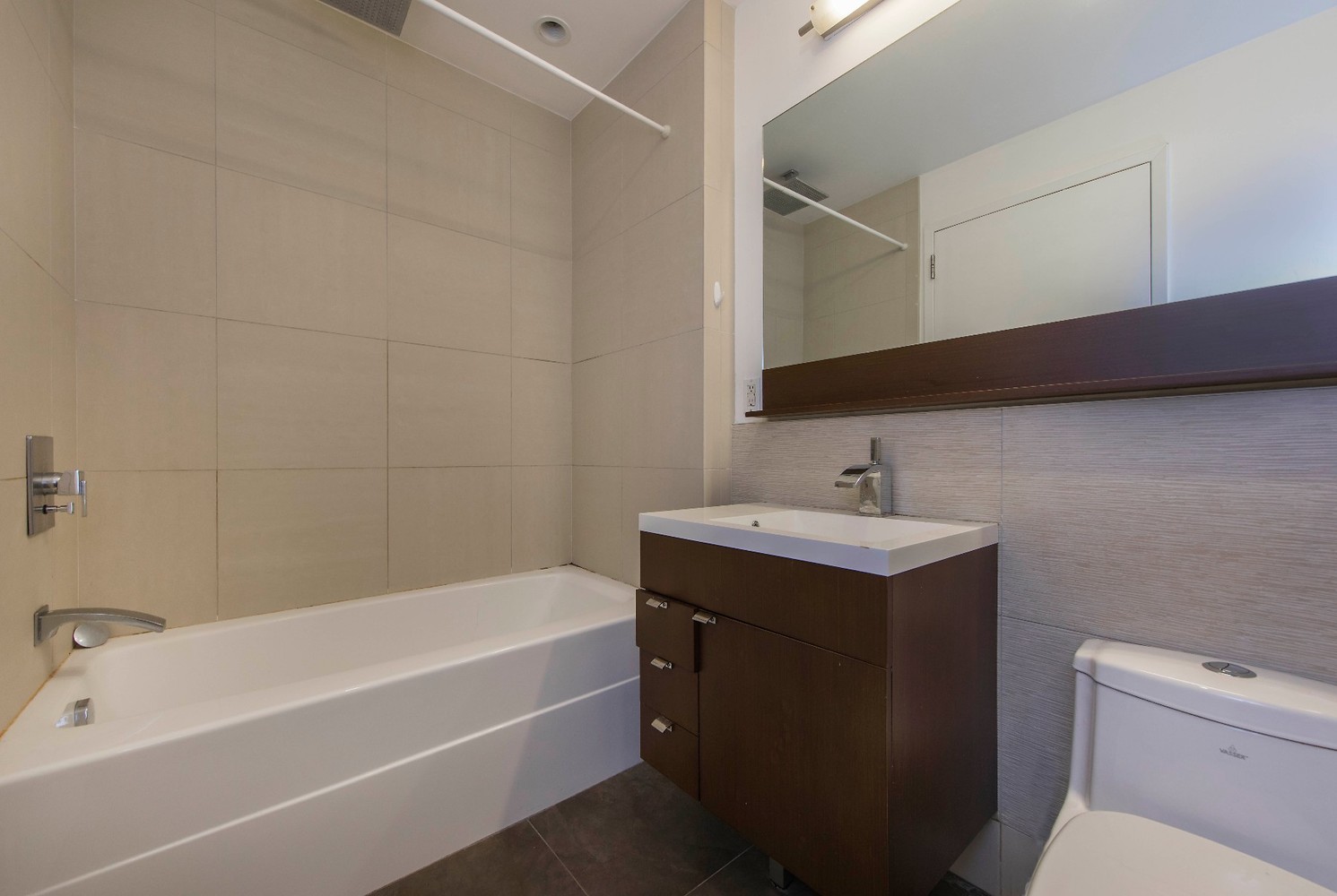 148 East 24th Street, Unit 4C Manhattan, NY 10010 - Photo 4 of 15 a bathroom with a sink and a bathtub