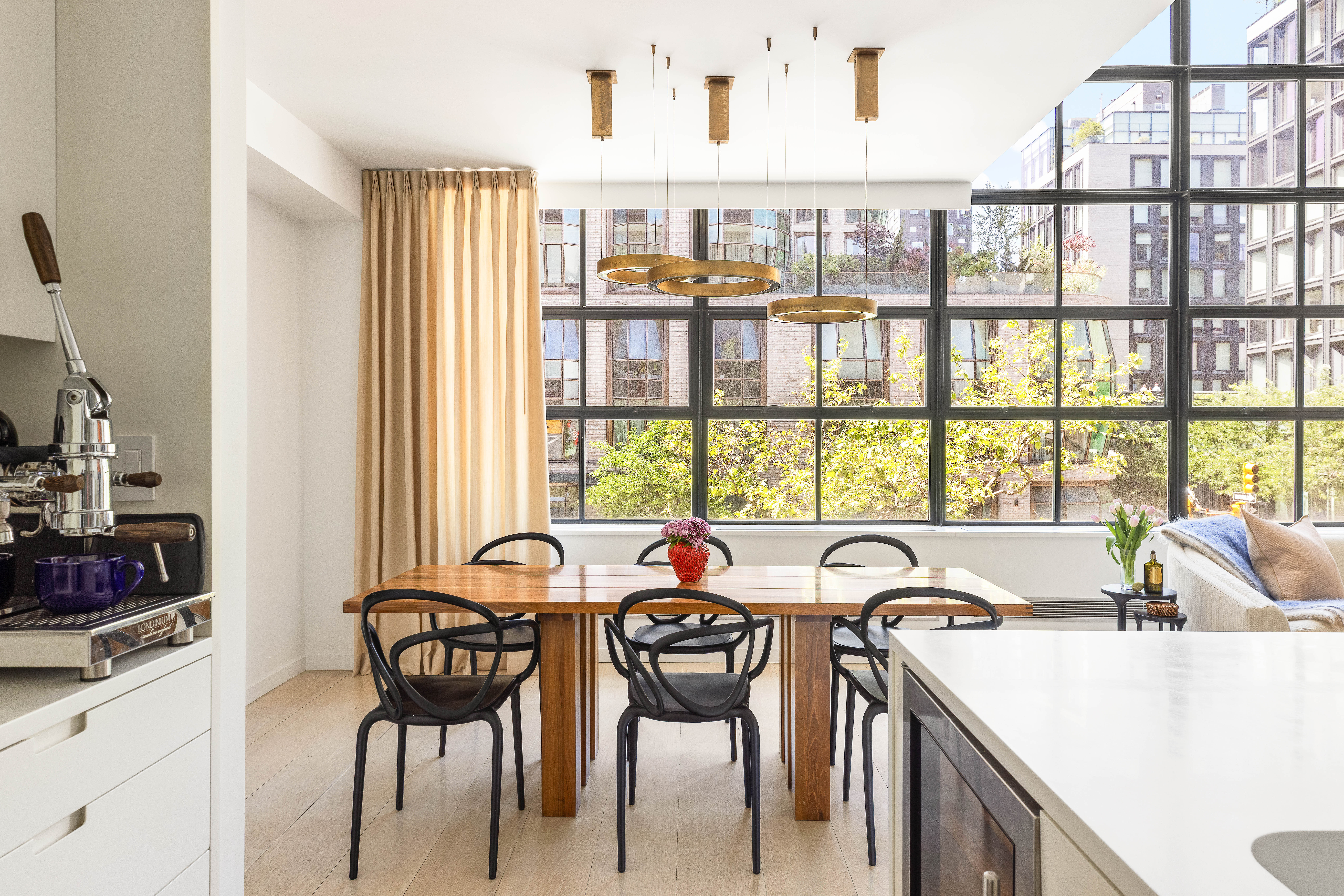 456 West 19th Street, Unit 2/3F Manhattan, NY 10011 - Photo 4 of 14 a view of a dining room with furniture window and outside view