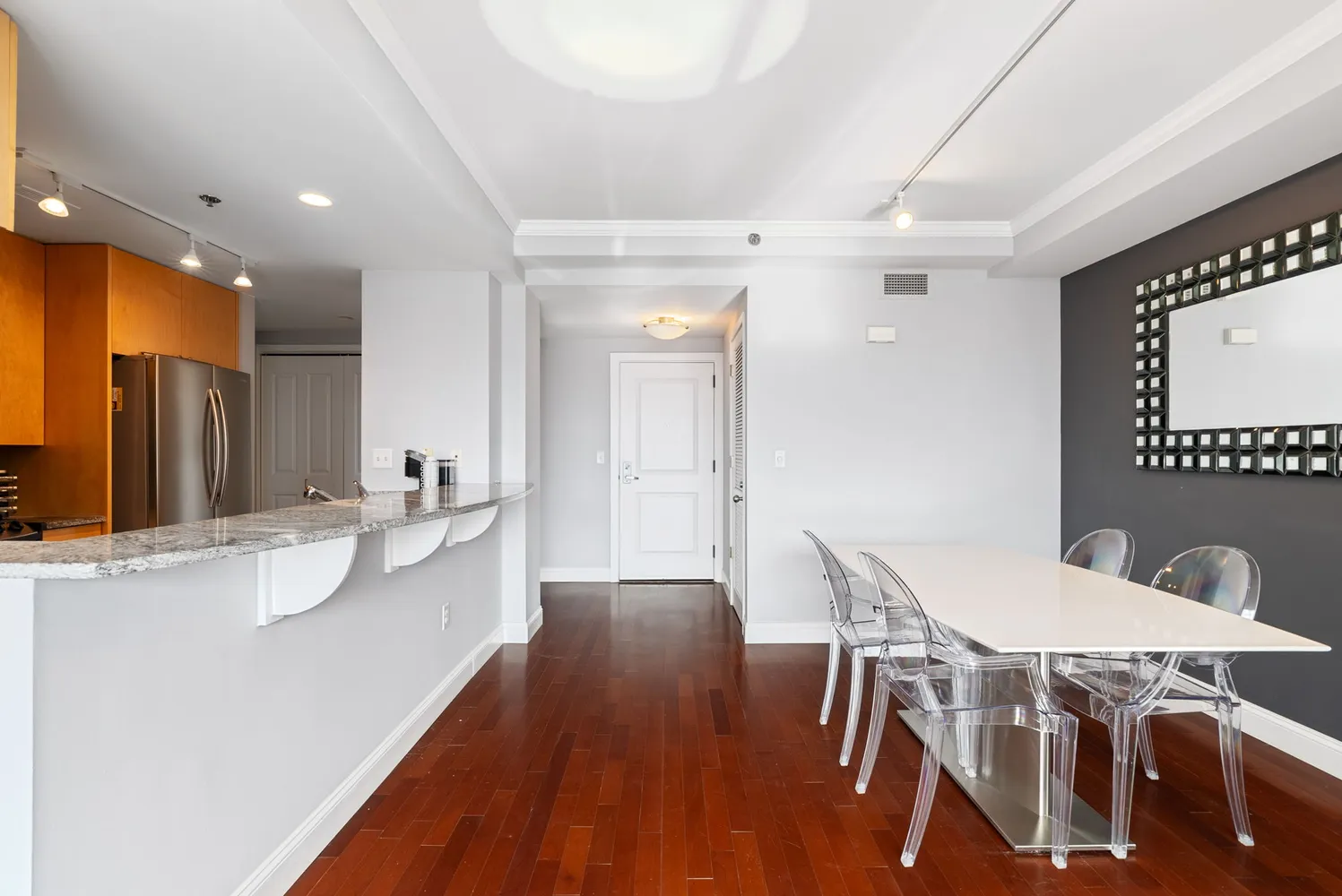 a bedroom with a large bed and a large window with outer view