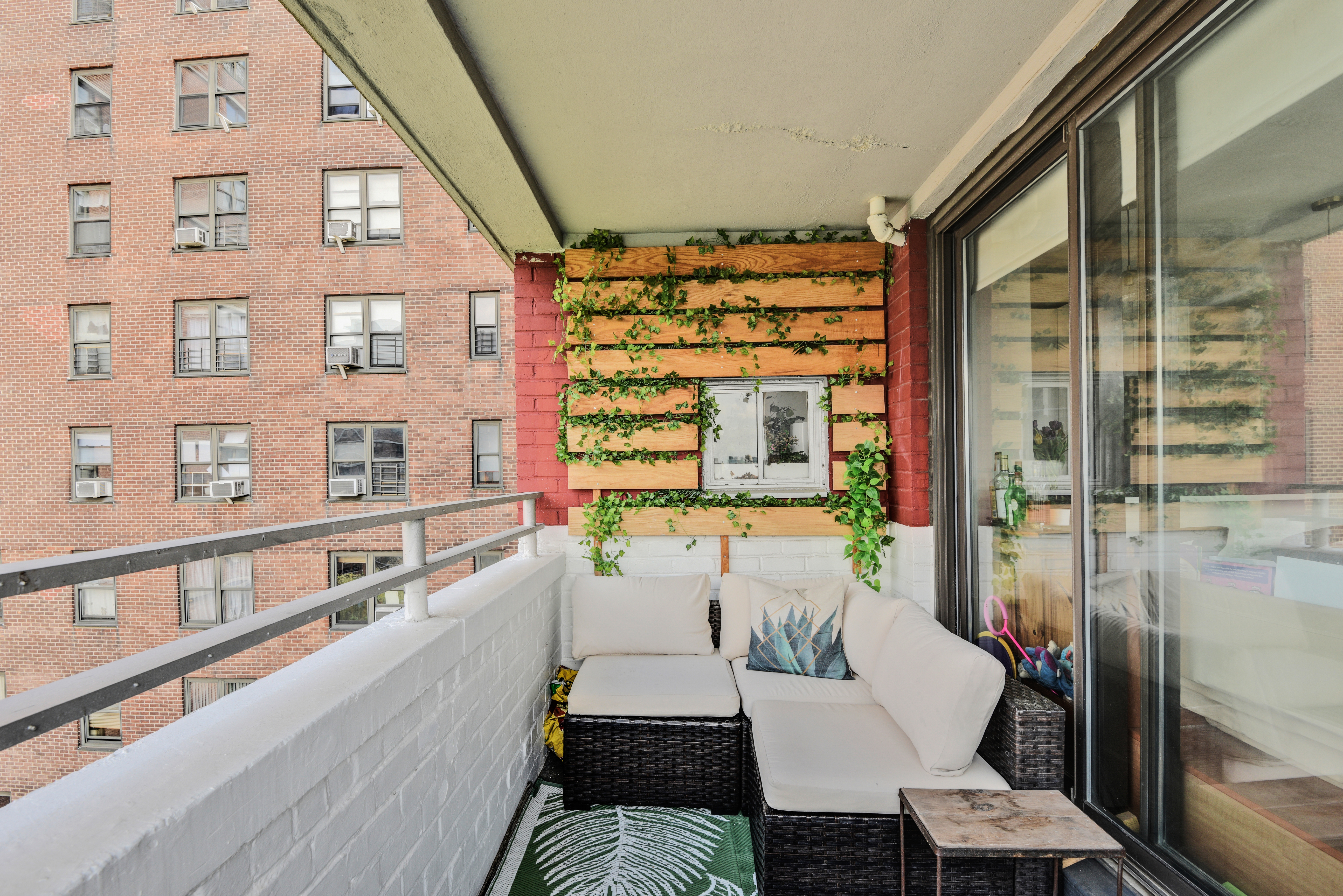 208 East Broadway, Unit J1304 Manhattan, NY 10002 - Photo 9 of 19 a living room with furniture and a large window