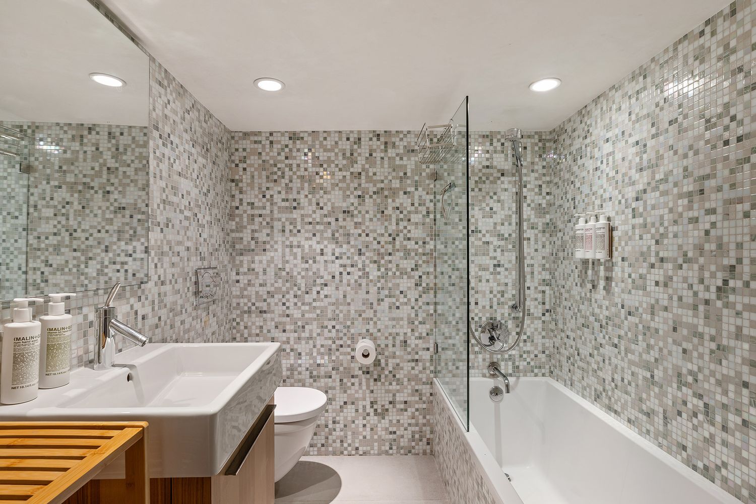 a bathroom with a bathtub and a sink