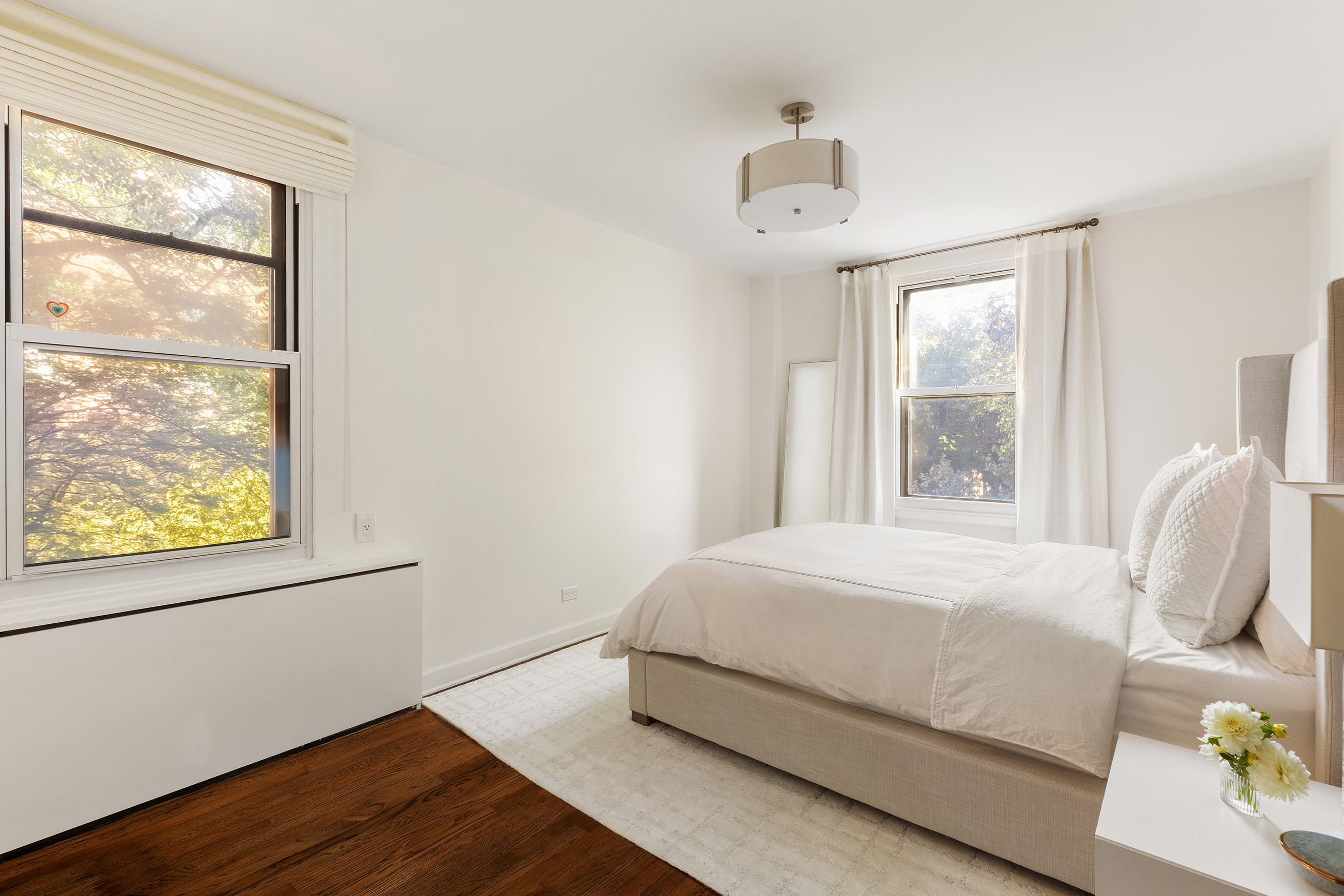 81 Bedford Street, Unit 4B Manhattan, NY 10014 - Photo 6 of 15 a bedroom with a bed and a window