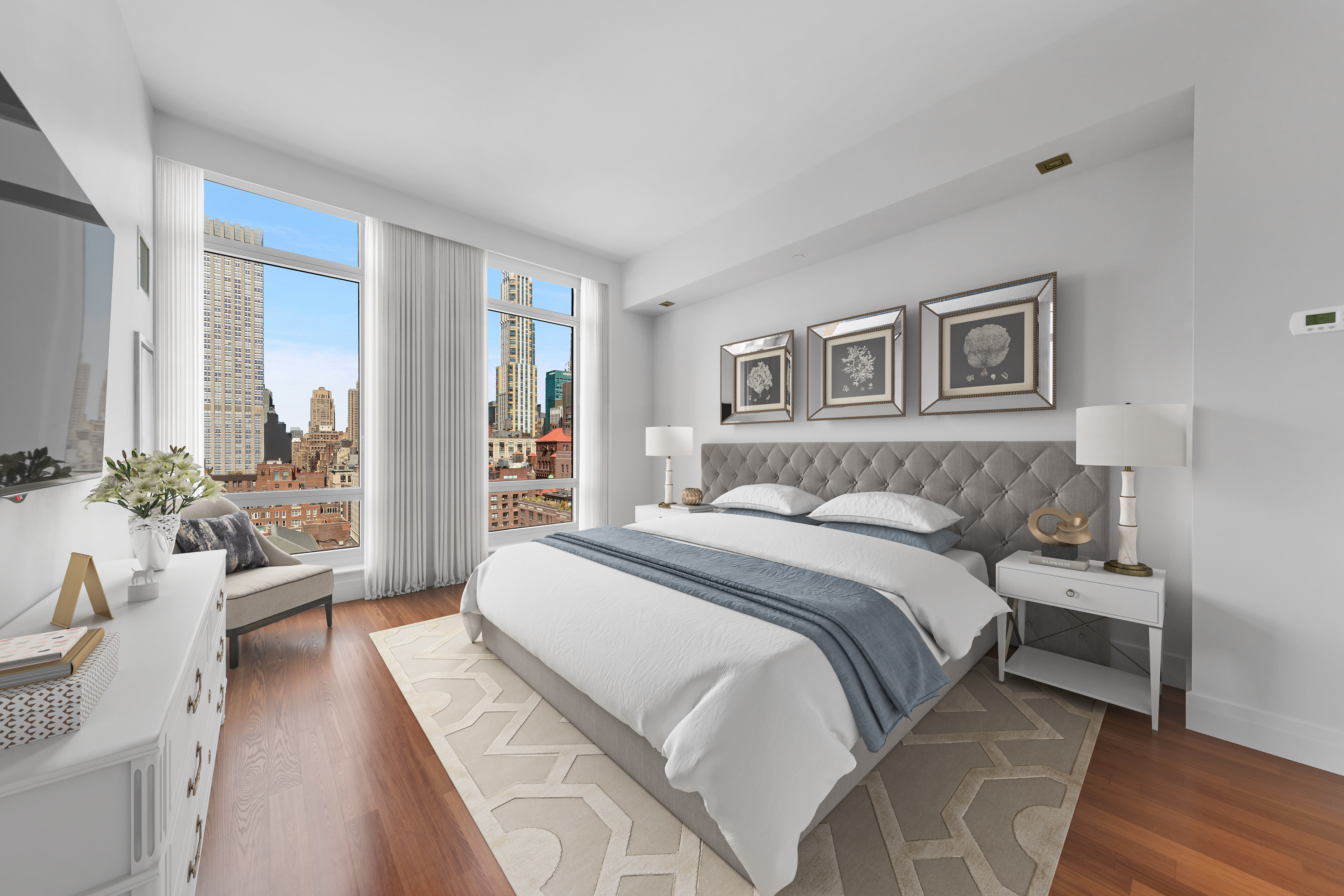 45 Park Avenue, Unit PH2 Manhattan, NY 10016 - Photo 5 of 11 a spacious bedroom with a bed and a large window