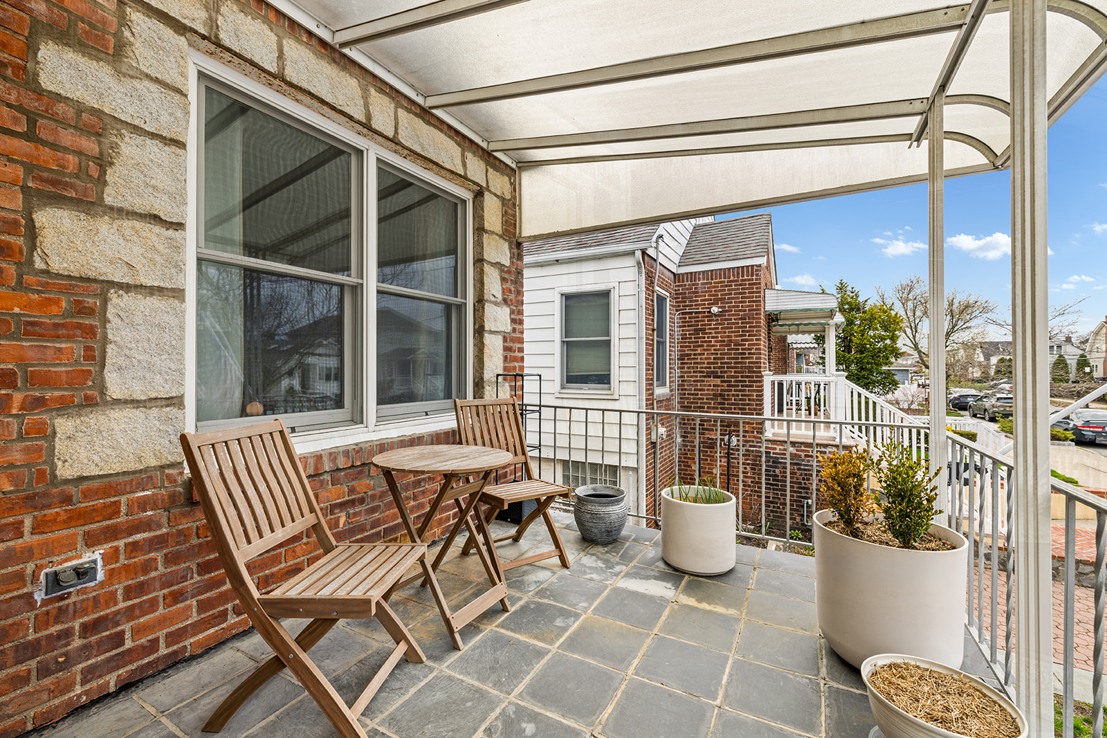 524 Beach 127th Street Queens, NY 11694 - Photo 2 of 18 a view of a patio with table and chairs and potted plants