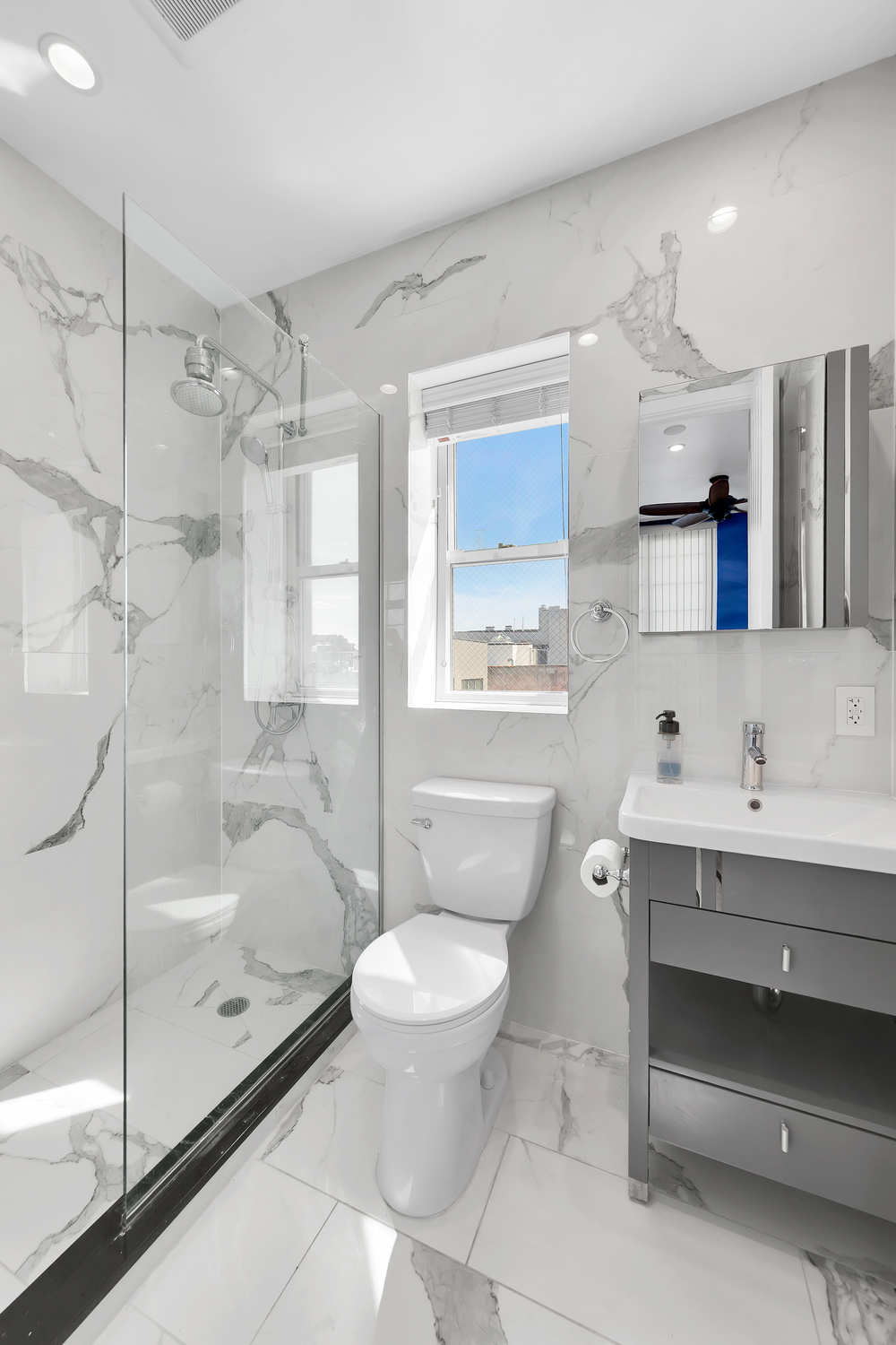 278 Nassau Avenue, Unit 4 Brooklyn, NY 11222 - Photo 14 of 17 a bathroom with a toilet sink and mirror