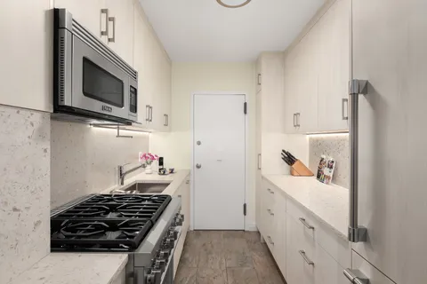 a kitchen with a stove and a microwave
