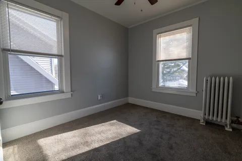 an empty room with closet area