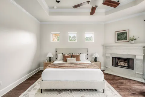 a view of a house with a yard and sitting area