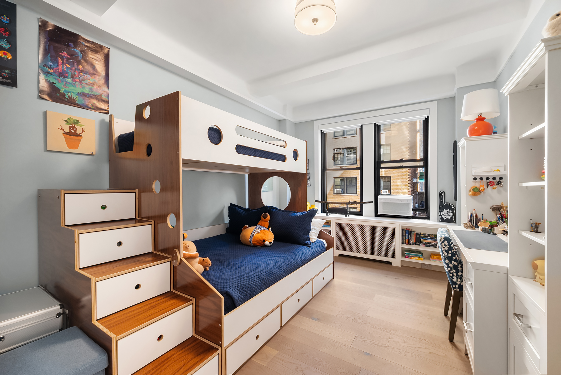 440 West End Avenue, Unit 2E Manhattan, NY 10024 - Photo 8 of 12 a living room with furniture and a large window