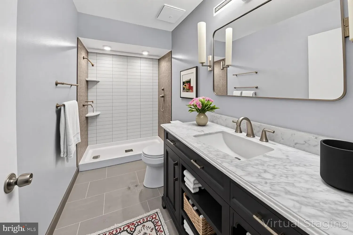 a bathroom with a granite countertop sink toilet and shower