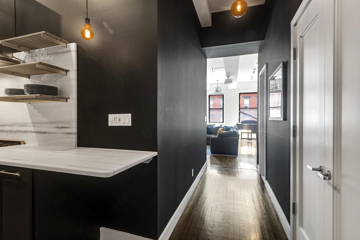 521 West 47th Street, Unit 3A Manhattan, NY 10036 - Photo 2 of 13 a kitchen with a refrigerator and a sink