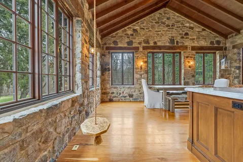 a bathroom with a sink toilet vanity and shower