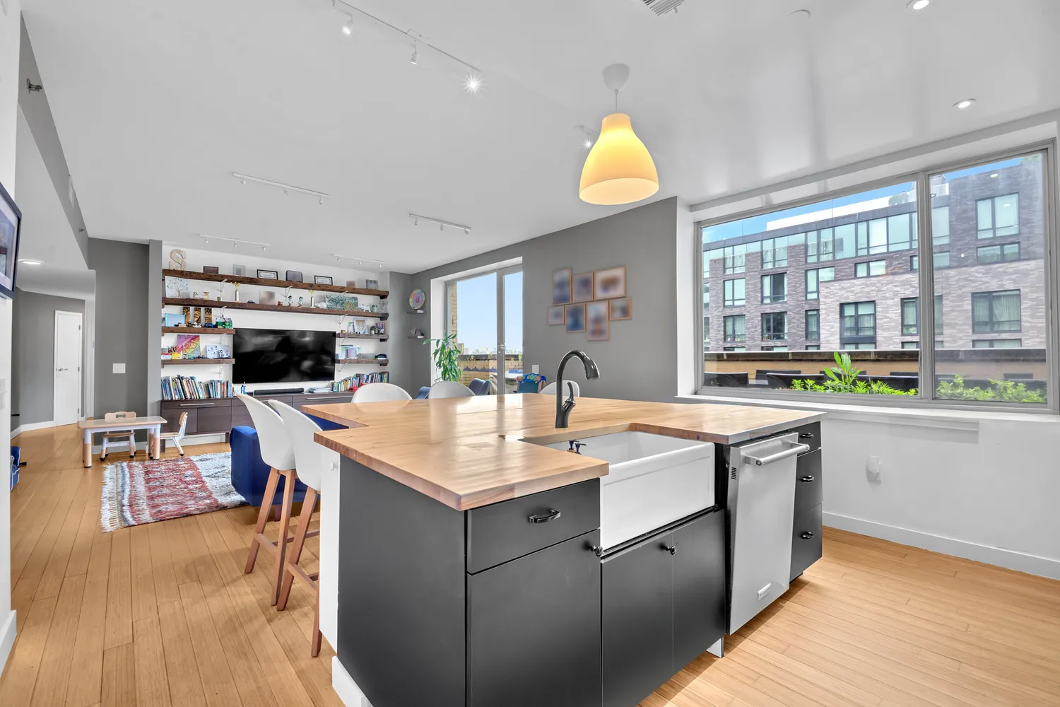 a large white kitchen with a large window