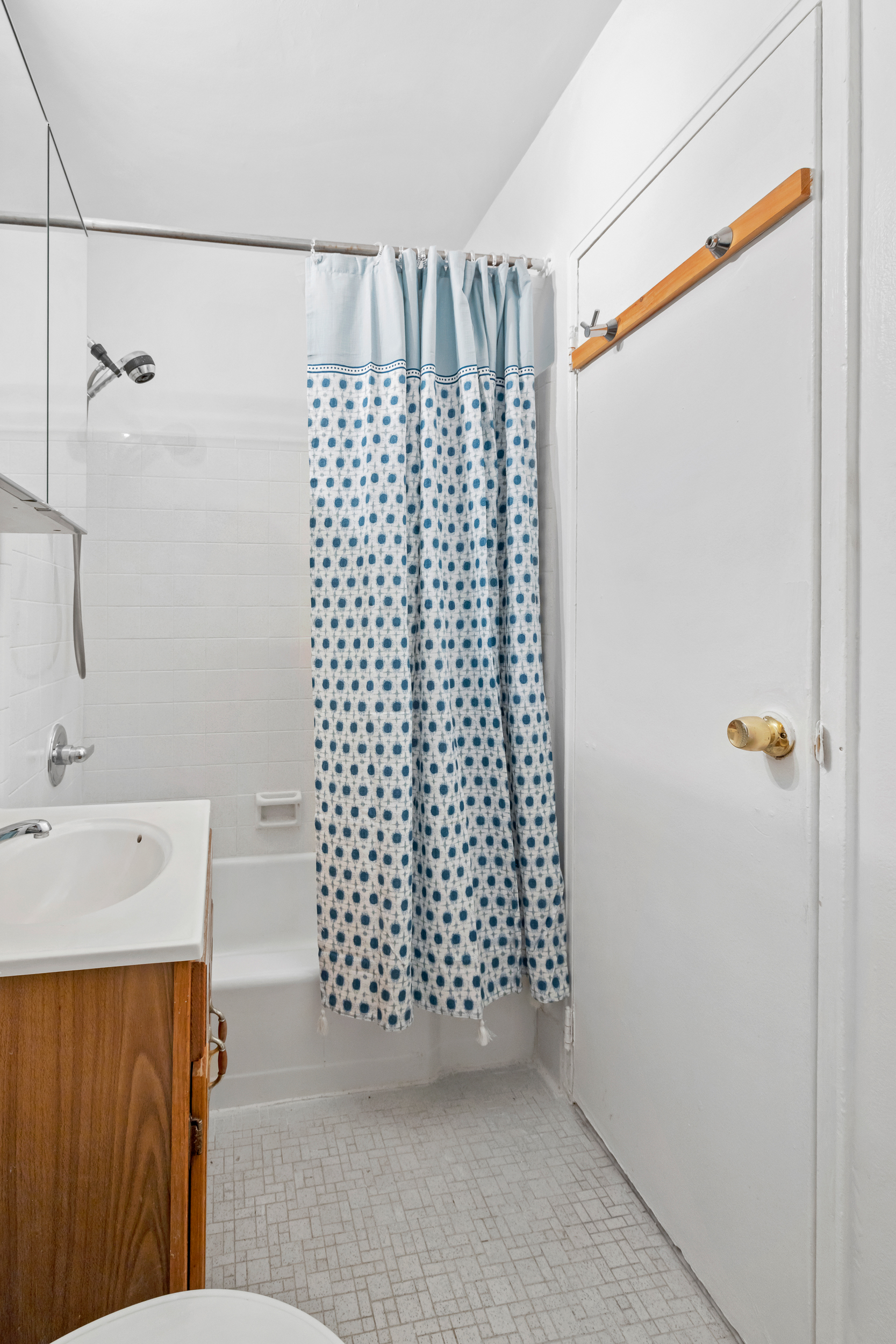 205 East 89th Street, Unit C4 Manhattan, NY 10128 - Photo 6 of 7 a bathroom with a shower curtain