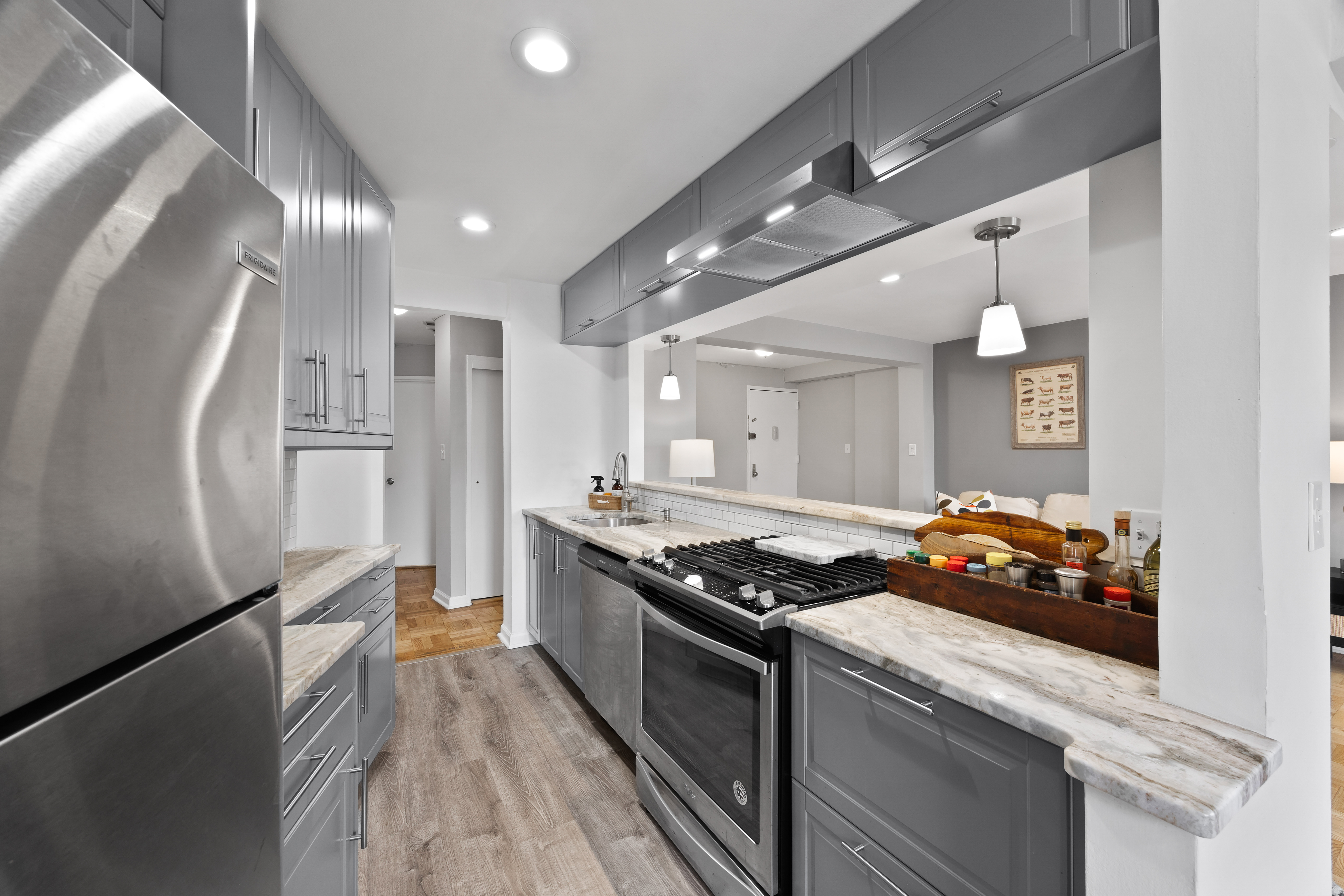 255 Fieldston Terrace, Unit 2L Bronx, NY 10471 - Photo 12 of 32 a kitchen with stainless steel appliances granite countertop a stove and a refrigerator