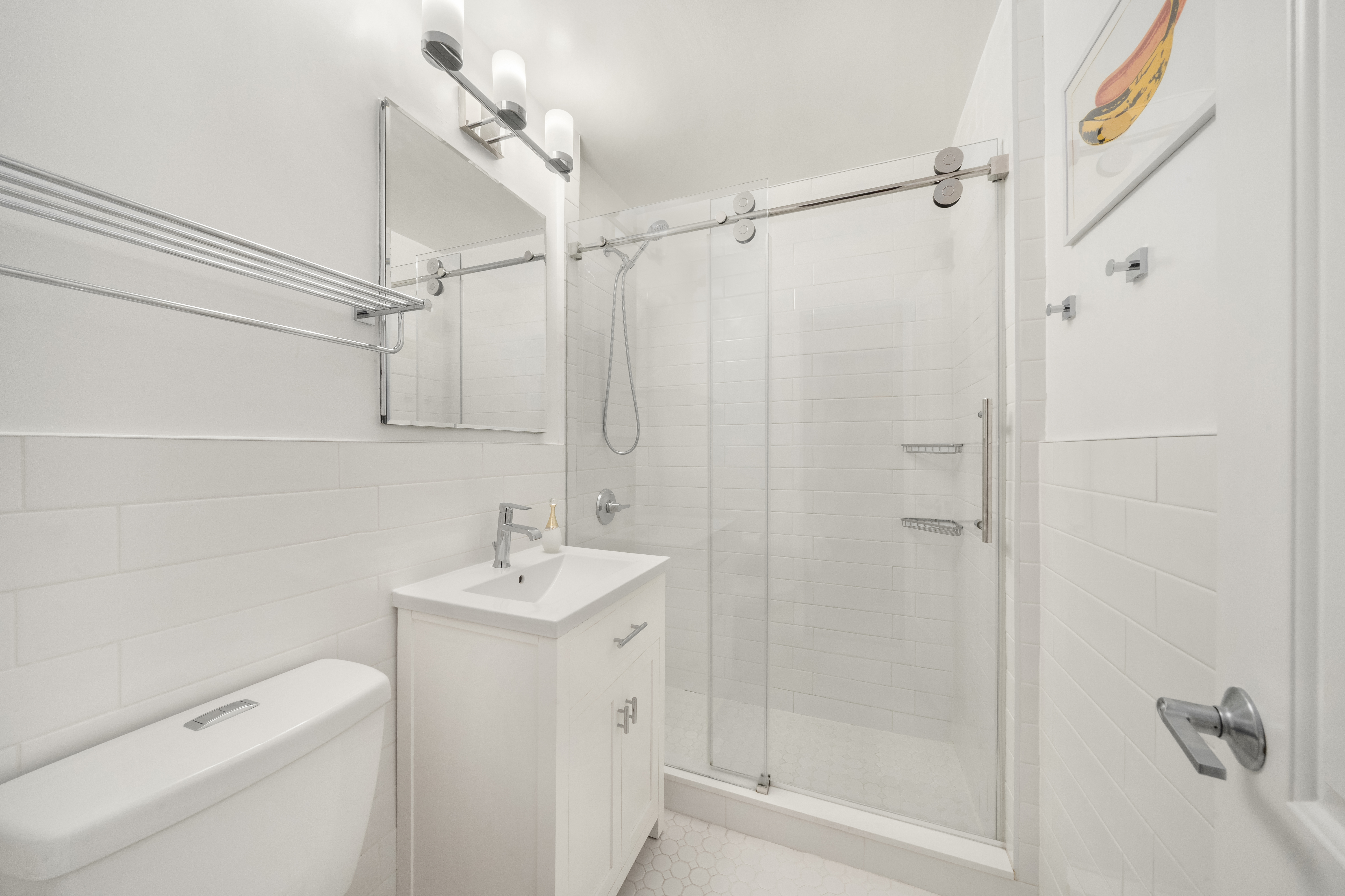 25 West 13th Street, Unit 6ON Manhattan, NY 10011 - Photo 6 of 7 a bathroom with a sink a toilet and shower