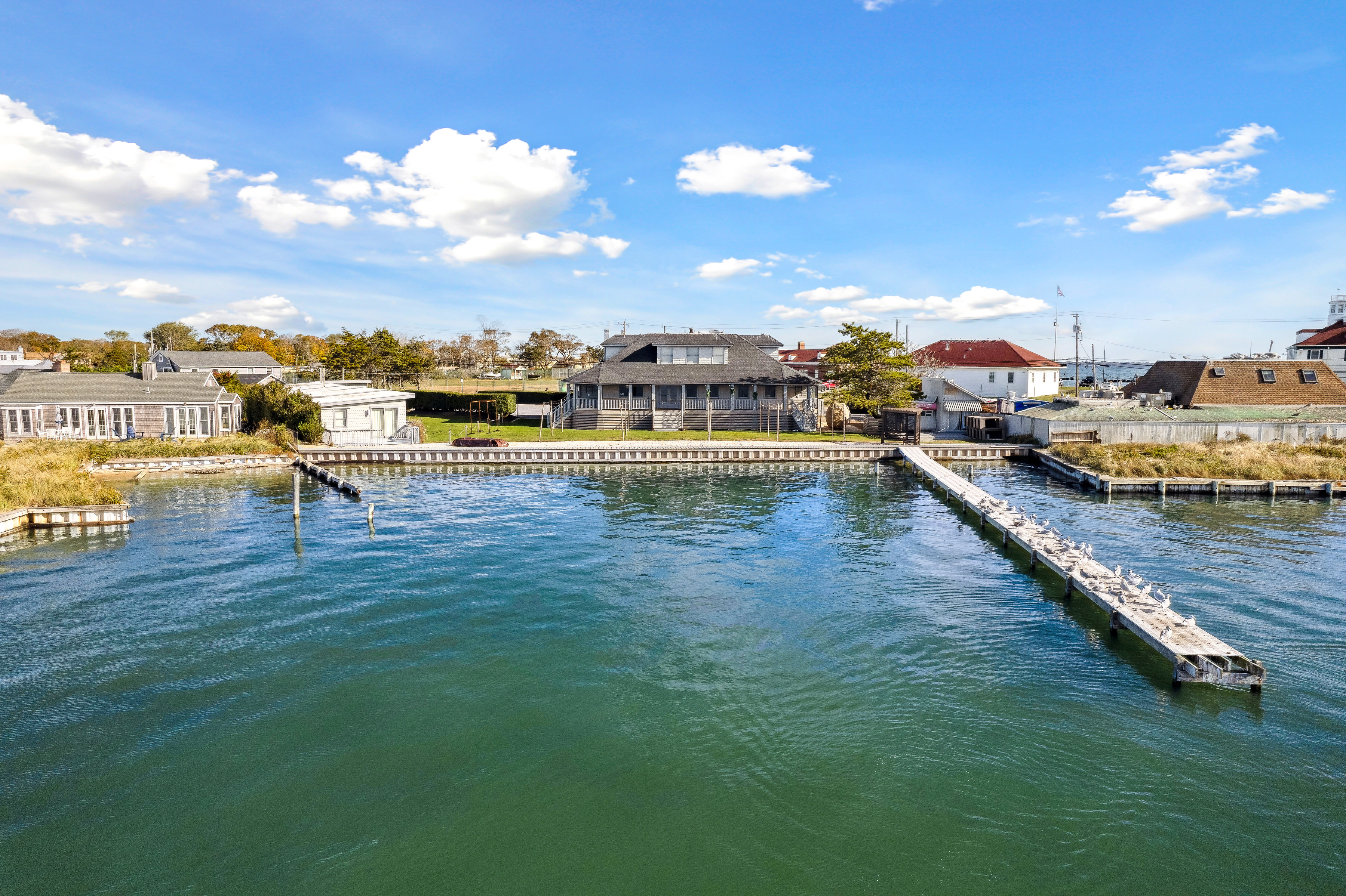 32 Lighthouse Road Hampton Bays, NY 11946 - Photo 11 of 51 a view of a lake with a terrace