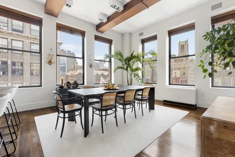 a dining room with furniture and window