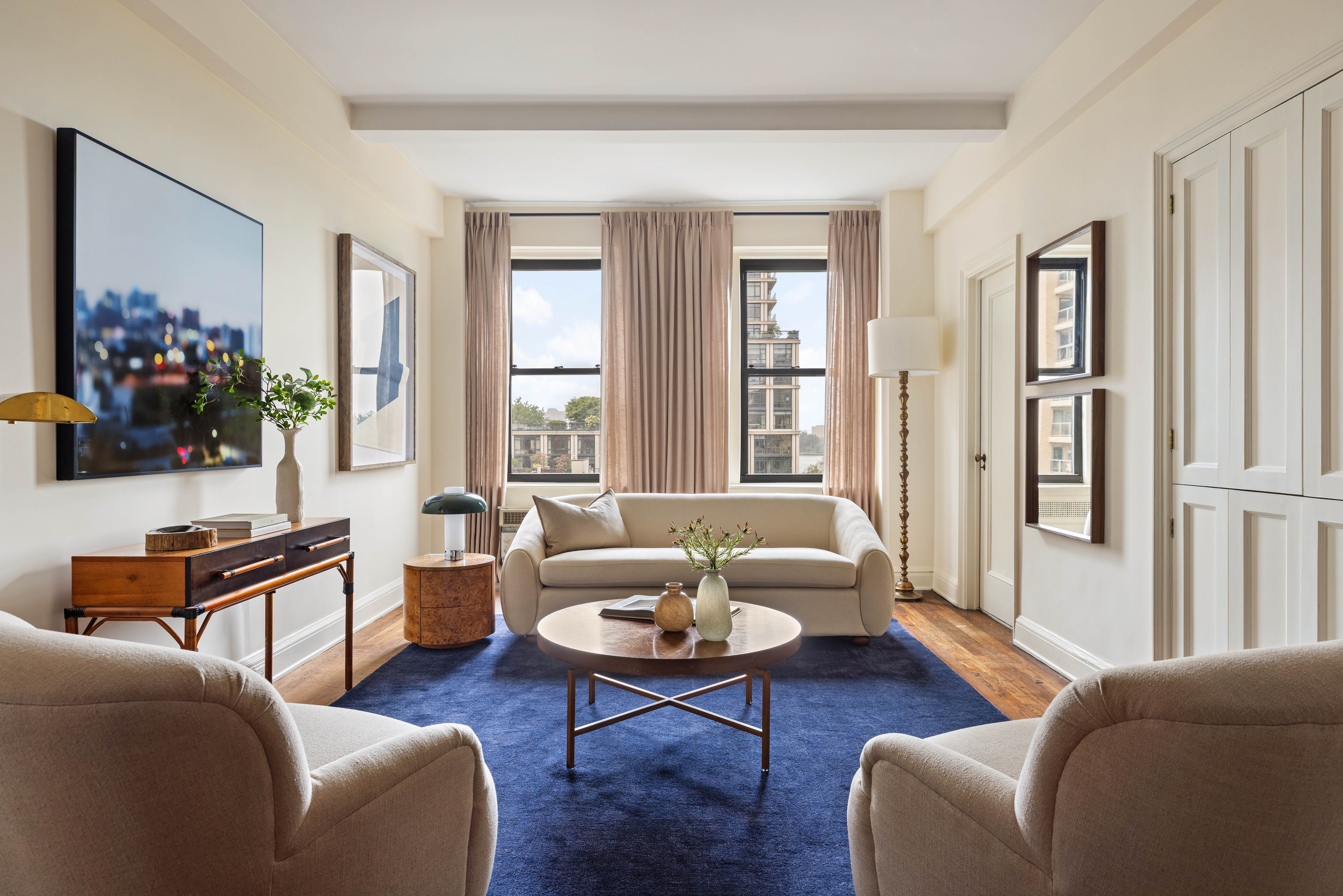 130 East End Avenue, Unit 8A Manhattan, NY 10028 - Photo 6 of 13 a living room with furniture wooden floor and a window