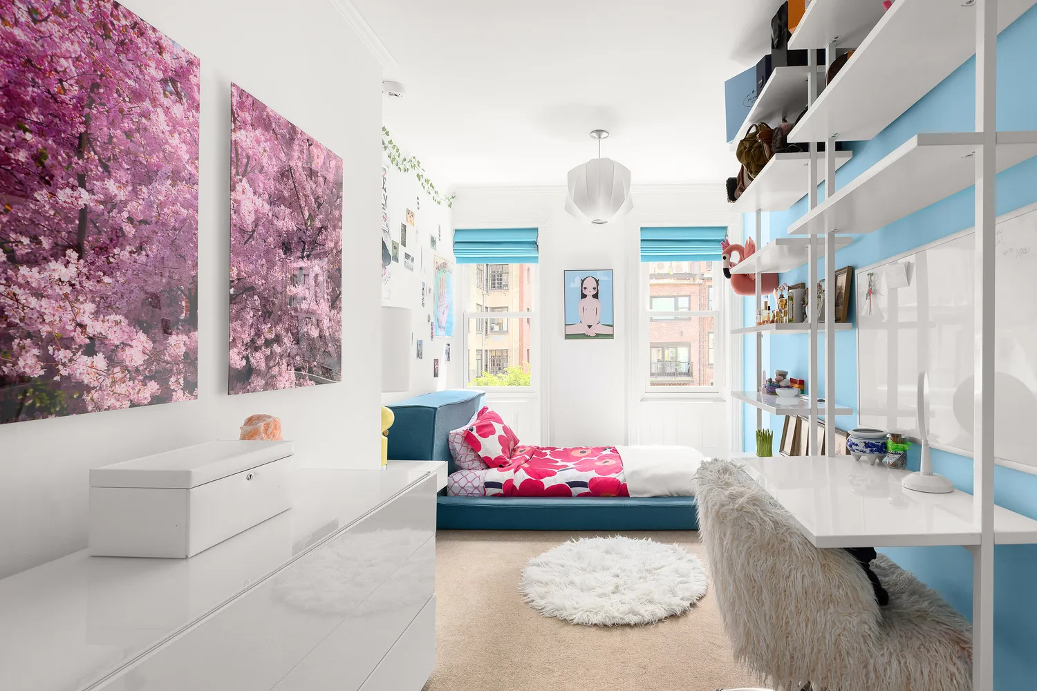 a bedroom with furniture and a large window