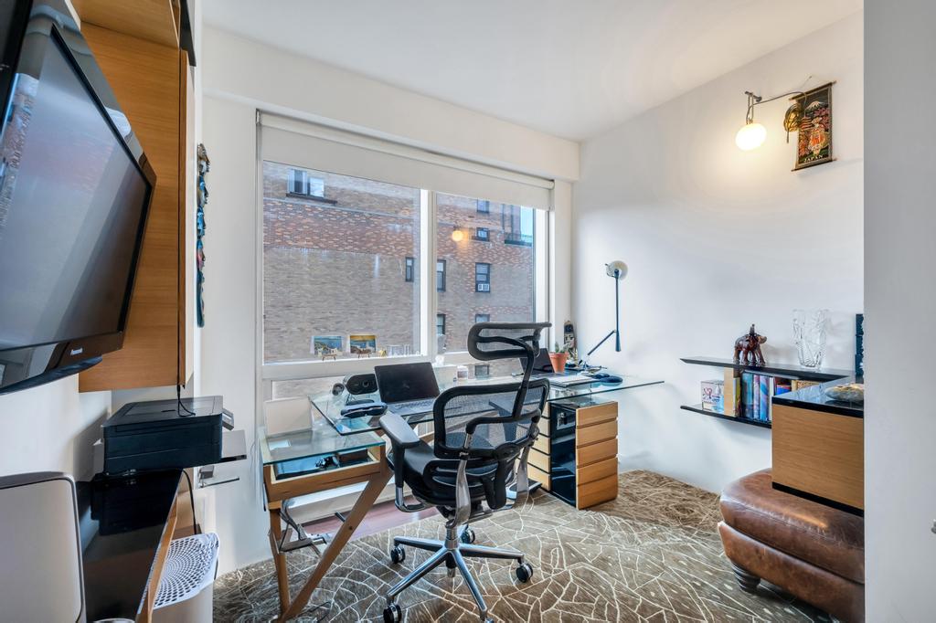 2628 Broadway, Unit 15B Manhattan, NY 10025 - Photo 7 of 21 a living room with furniture and a flat screen tv