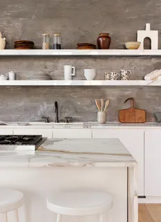 a kitchen with stainless steel appliances a stove and cabinets
