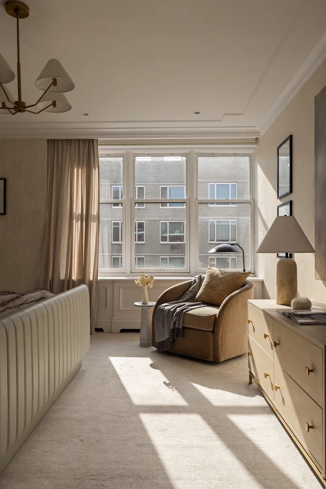 a bedroom with furniture and a window