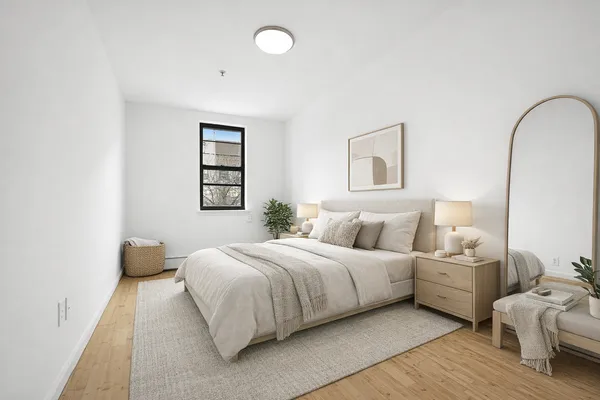 a bedroom with bed and a window