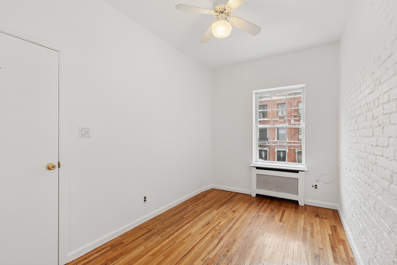 39 West 83rd Street, Unit 9 Manhattan, NY 10024 - Photo 2 of 5 an empty room with wooden floor and windows
