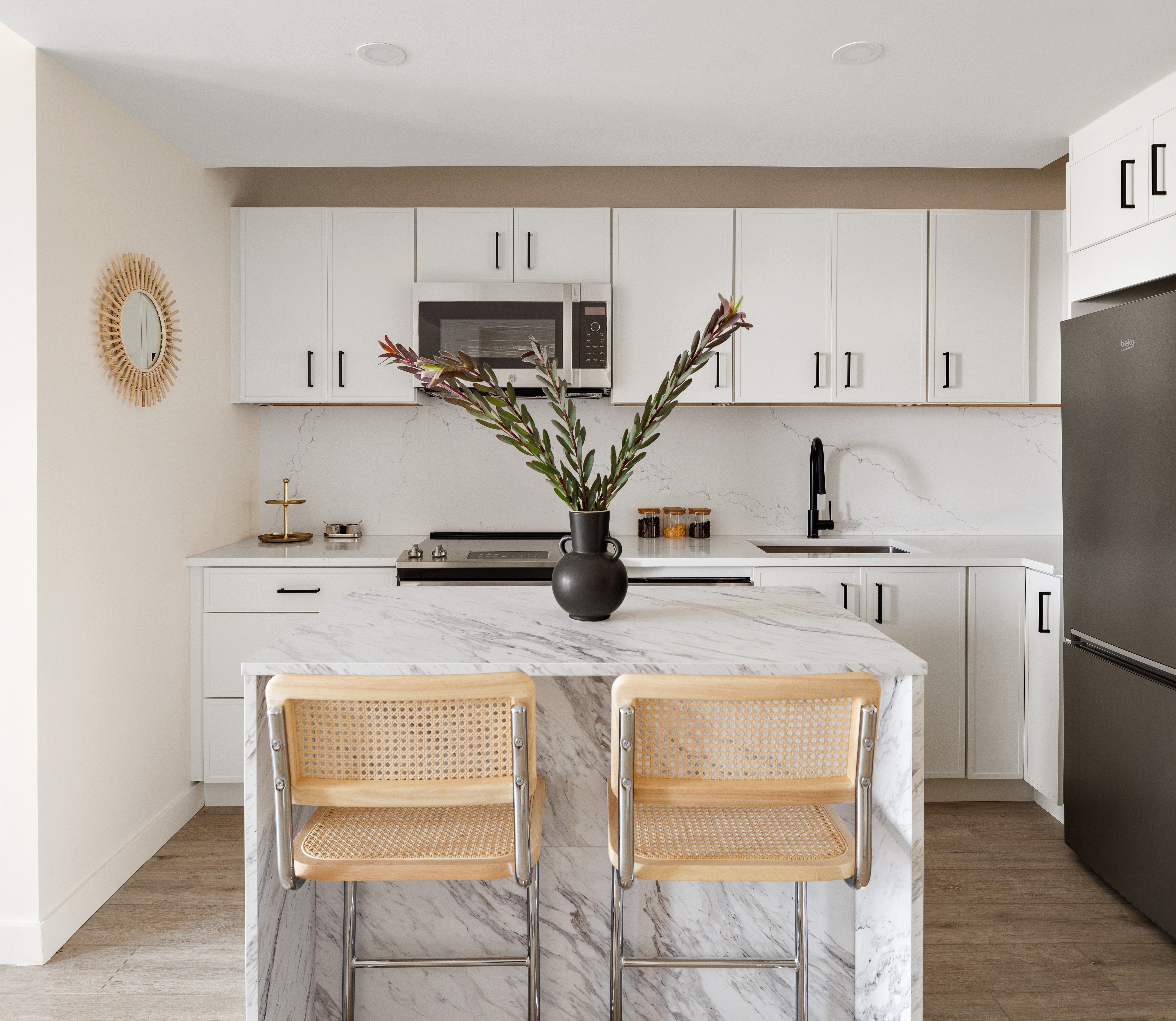 130 East 177th Street, Unit 8A Bronx, NY 10453 - Photo 2 of 16 a kitchen with kitchen island a stove a sink and a refrigerator