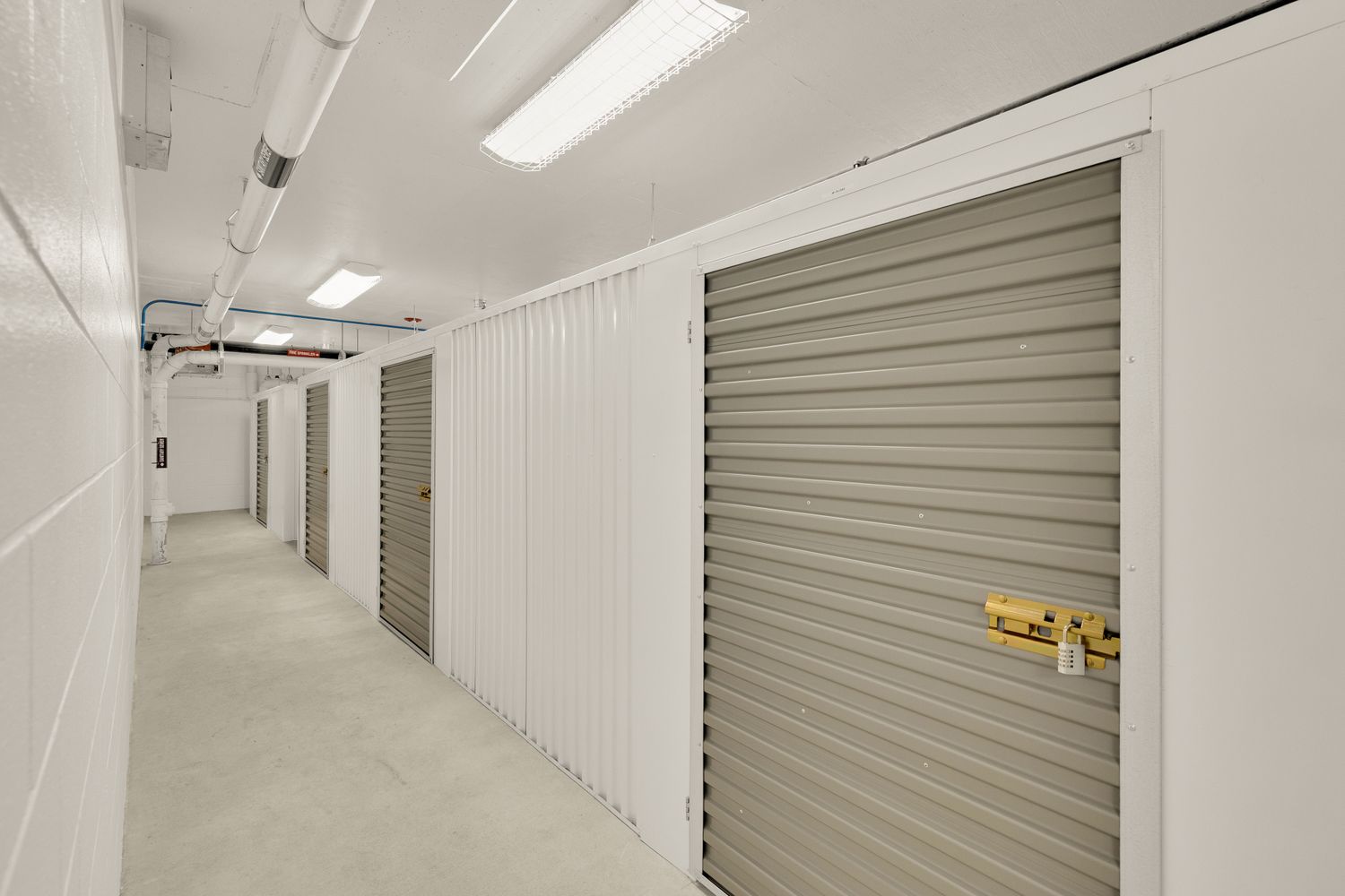 a view of water with boats and trees in the background