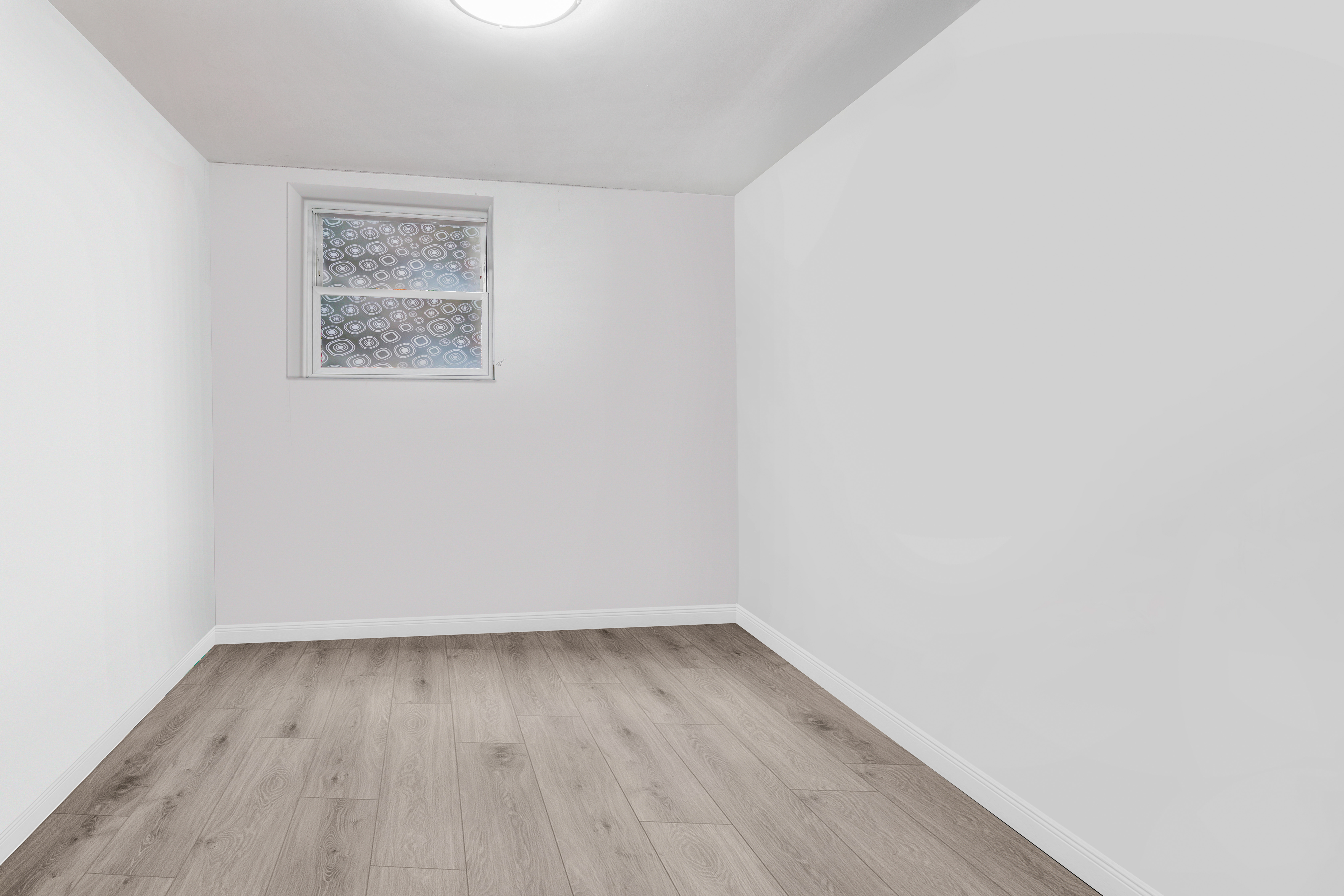 364 Chauncey Street Brooklyn, NY 11233 - Photo 5 of 17 an empty room with a bench