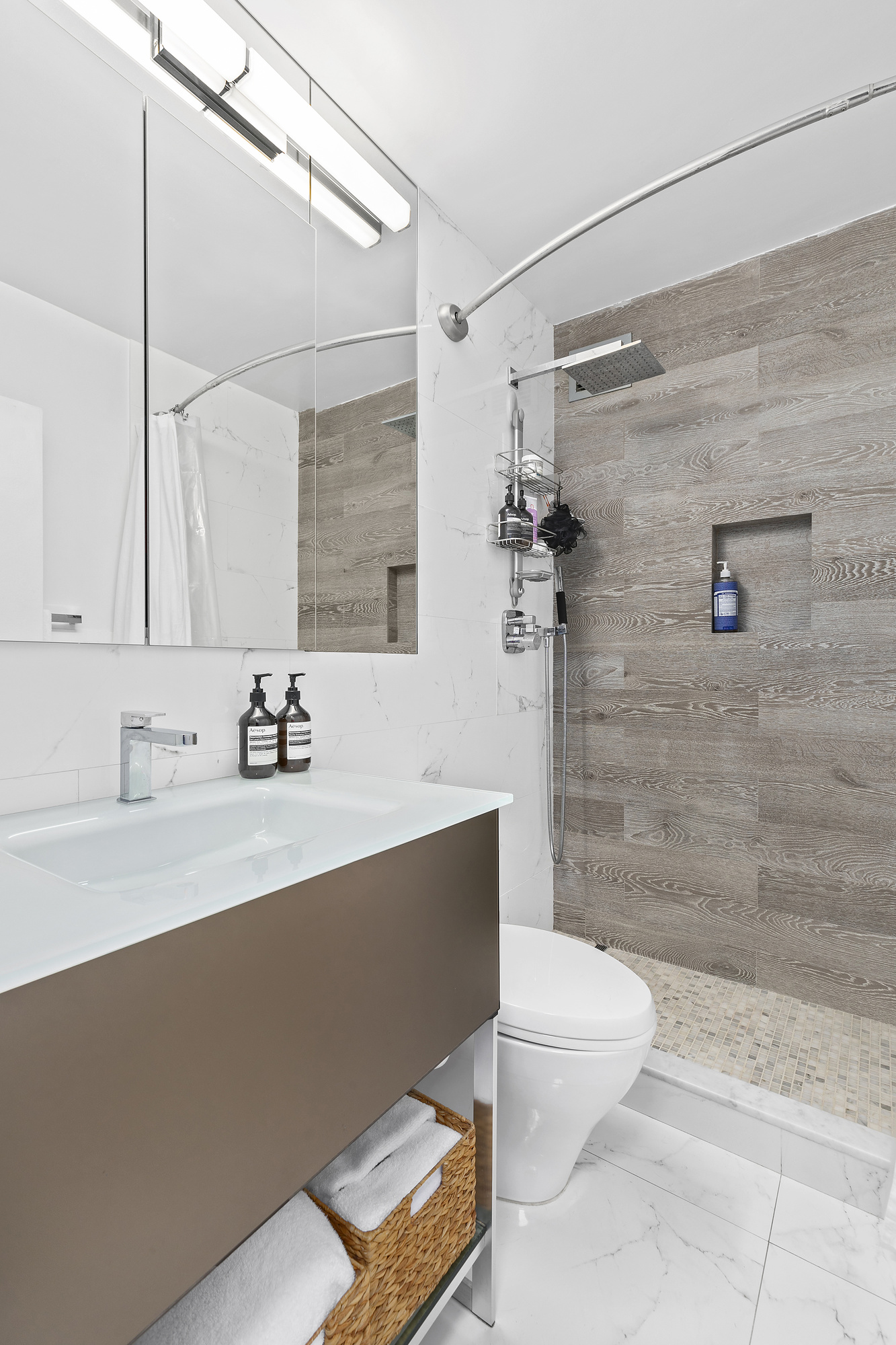 420 West 23rd Street, Unit 6B Manhattan, NY 10011 - Photo 8 of 11 a bathroom with a sink a toilet and shower
