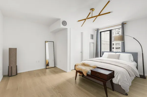a bedroom with a bed and a table