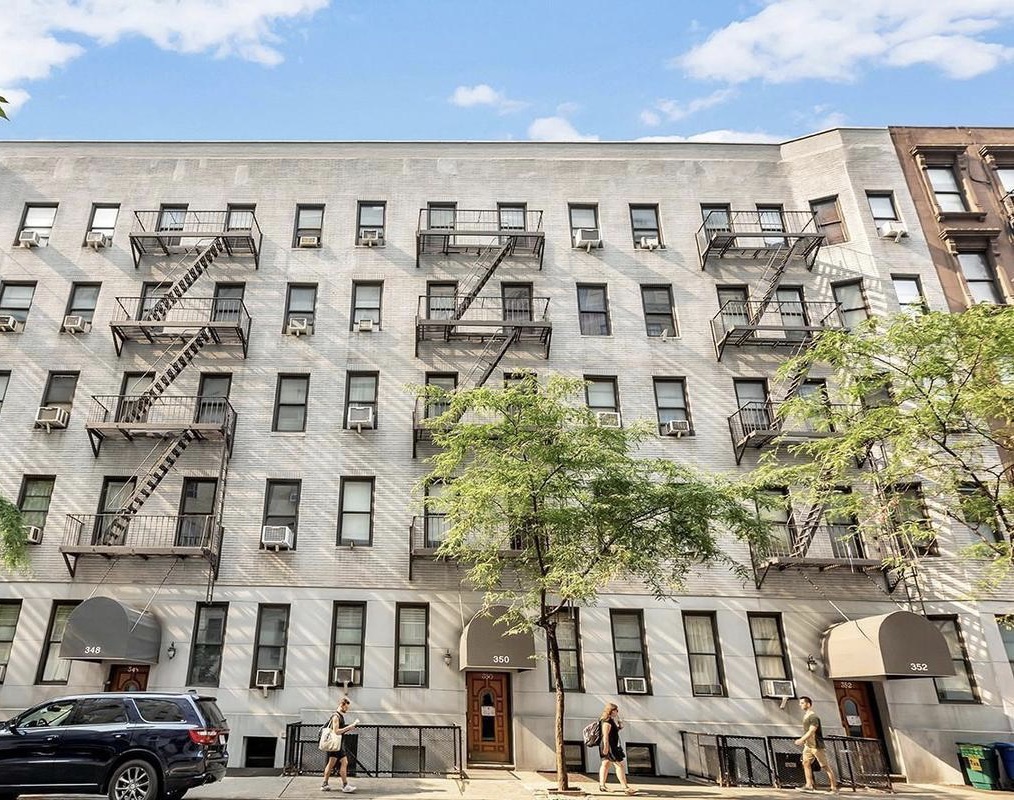 350 West 56th Street, Unit 1A Manhattan, NY 10019 - Photo 8 of 17 a front view of a building with a lot of windows
