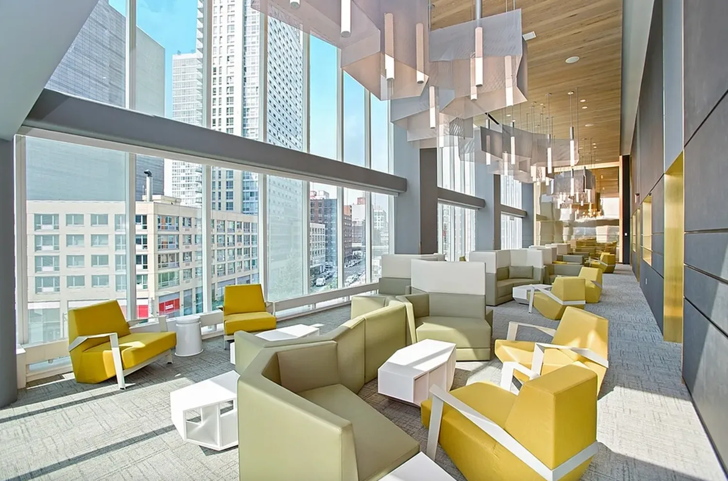 a living room with furniture and a floor to ceiling window