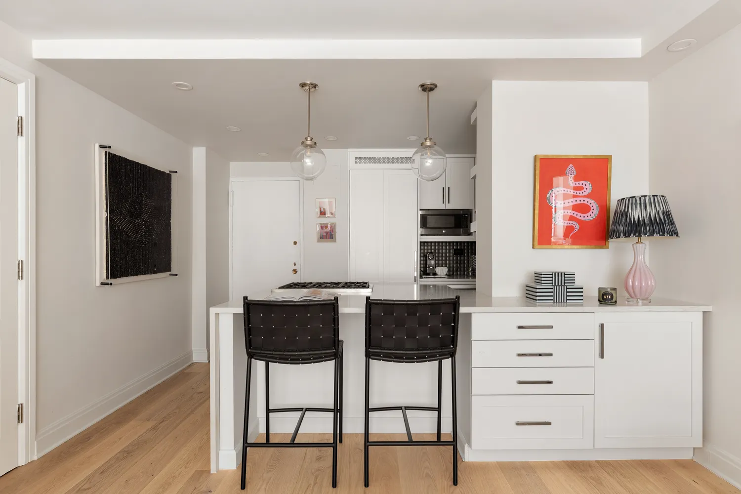 a kitchen with stainless steel appliances a stove and cabinets