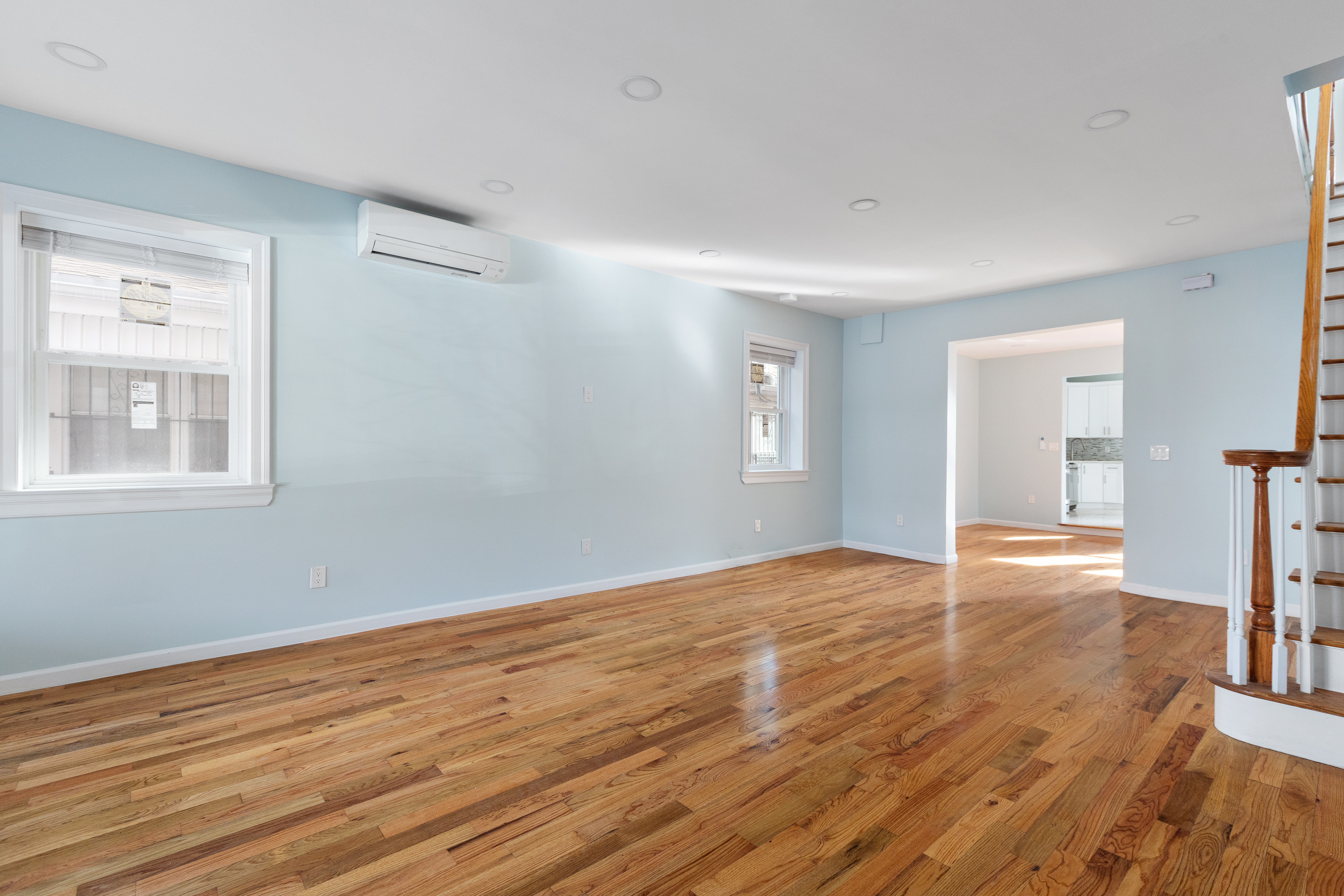 2773 Bedford Avenue Brooklyn, NY 11210 - Photo 4 of 17 a view of empty room with wooden floor and fan