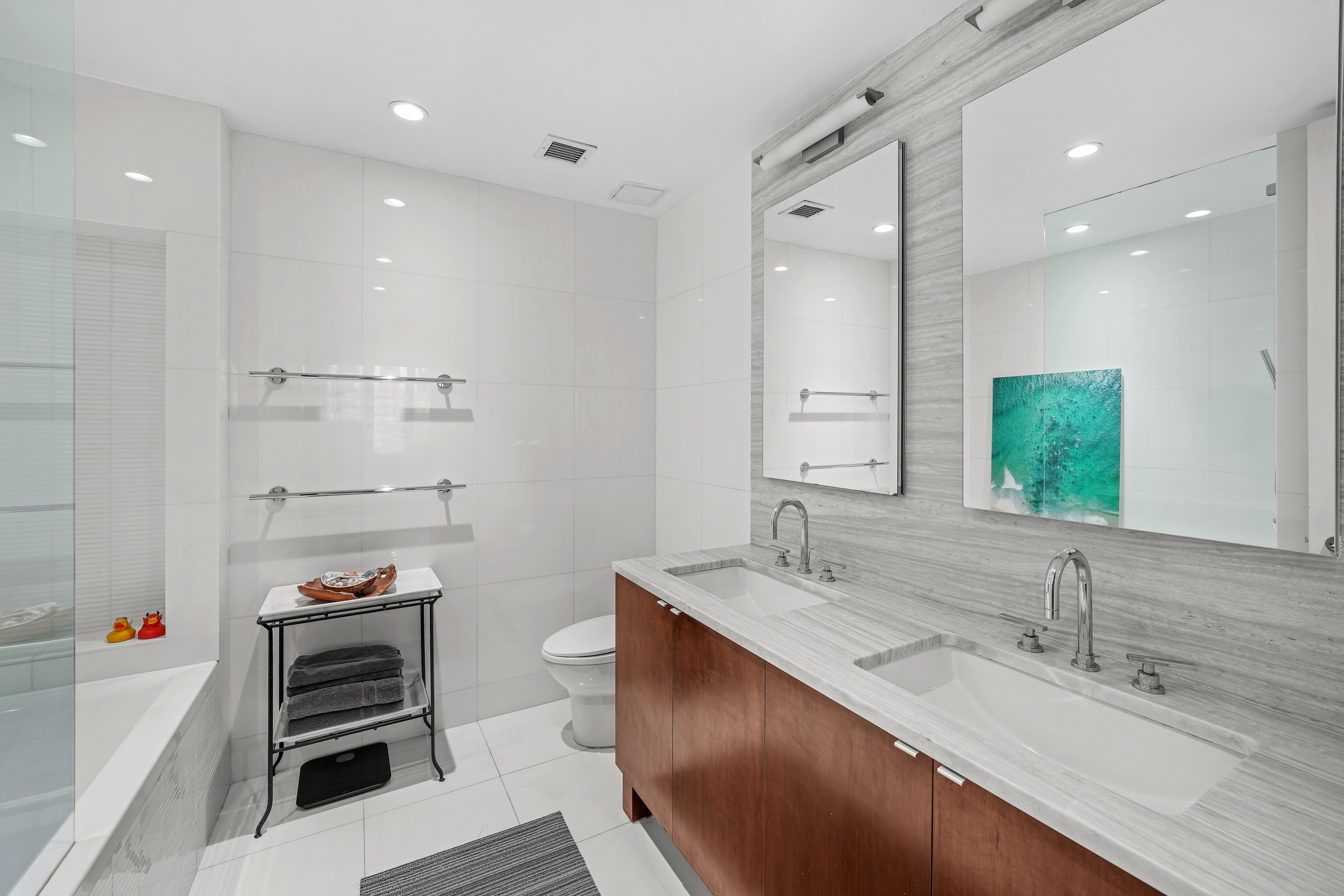 117 West 123rd Street, Unit 1B Manhattan, NY 10027 - Photo 14 of 25 a bathroom with a double vanity sink and a mirror