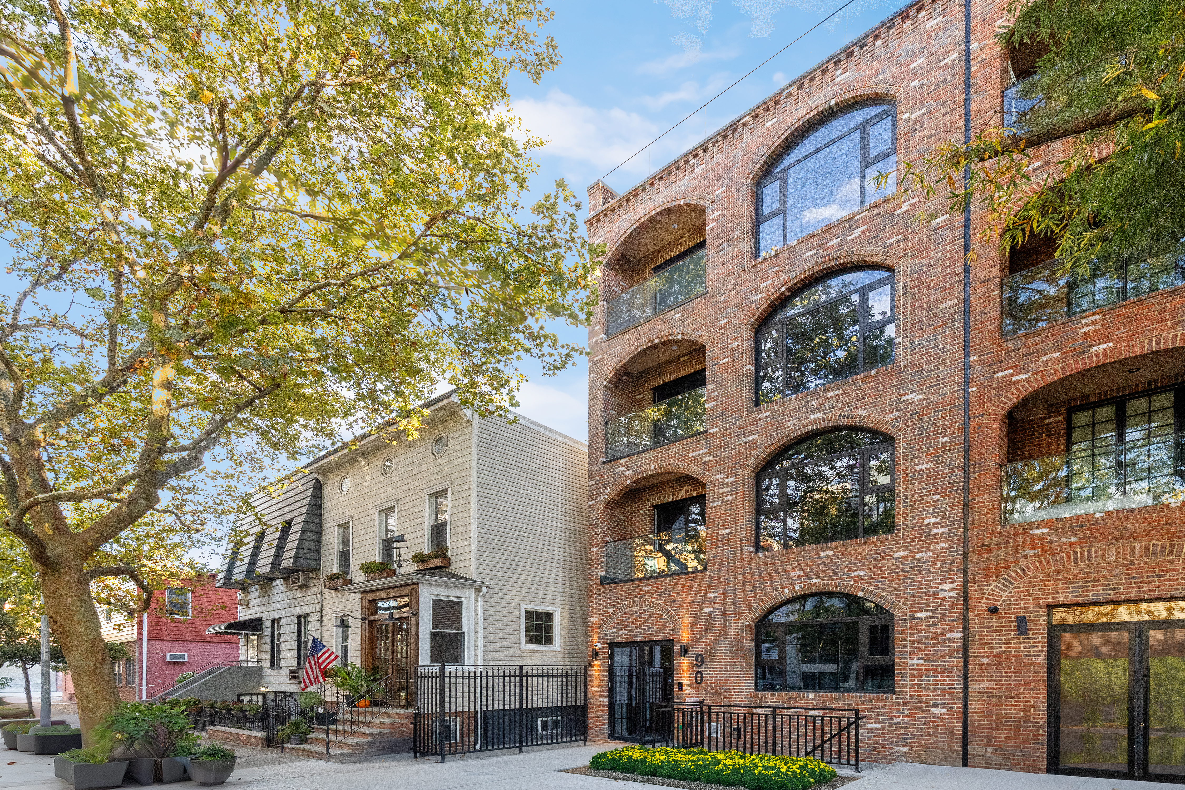 90 Herbert Street, Unit 2A Brooklyn, NY 11222 - Photo 1 of 10 a front view of residential building with yard and outdoor seating