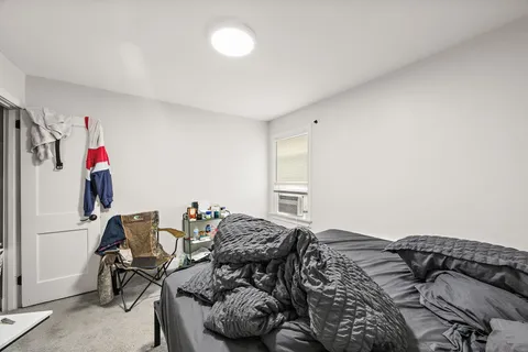 a bedroom with a bed and furniture