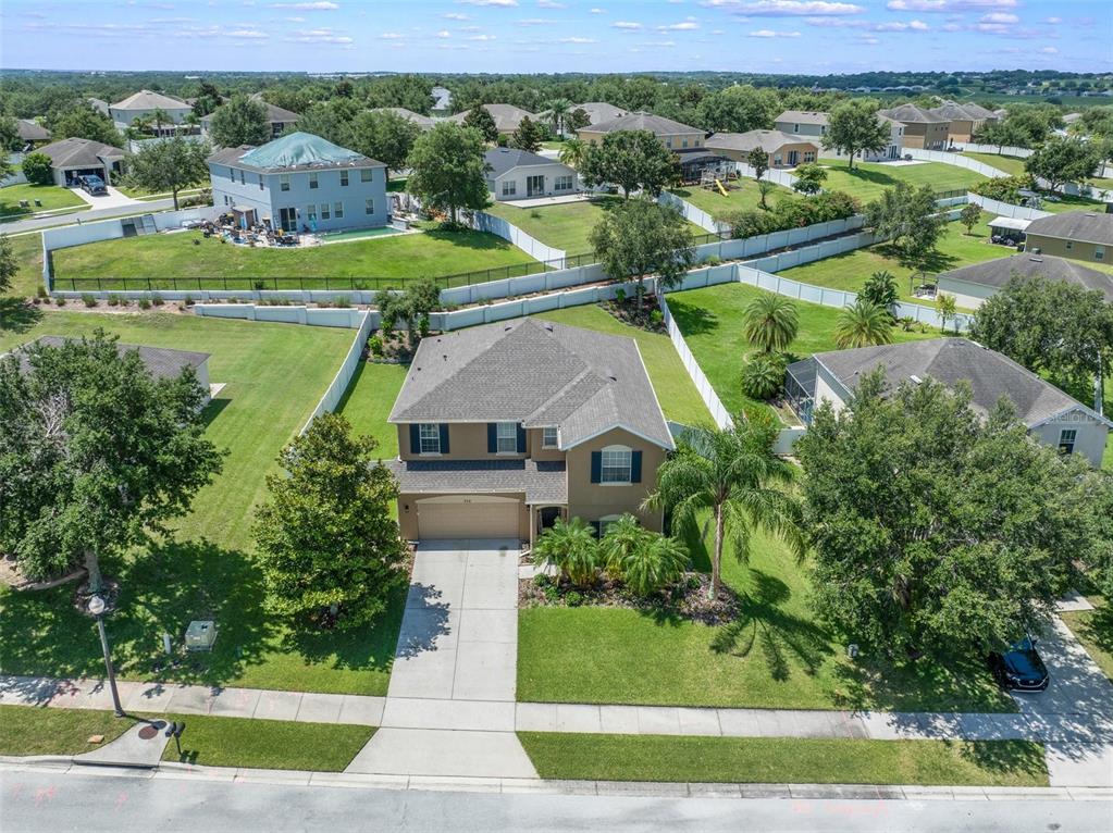 352 Giovani Boulevard Clermont, FL 34715 - Photo 44 of 46 an aerial view of residential houses with outdoor space and swimming pool