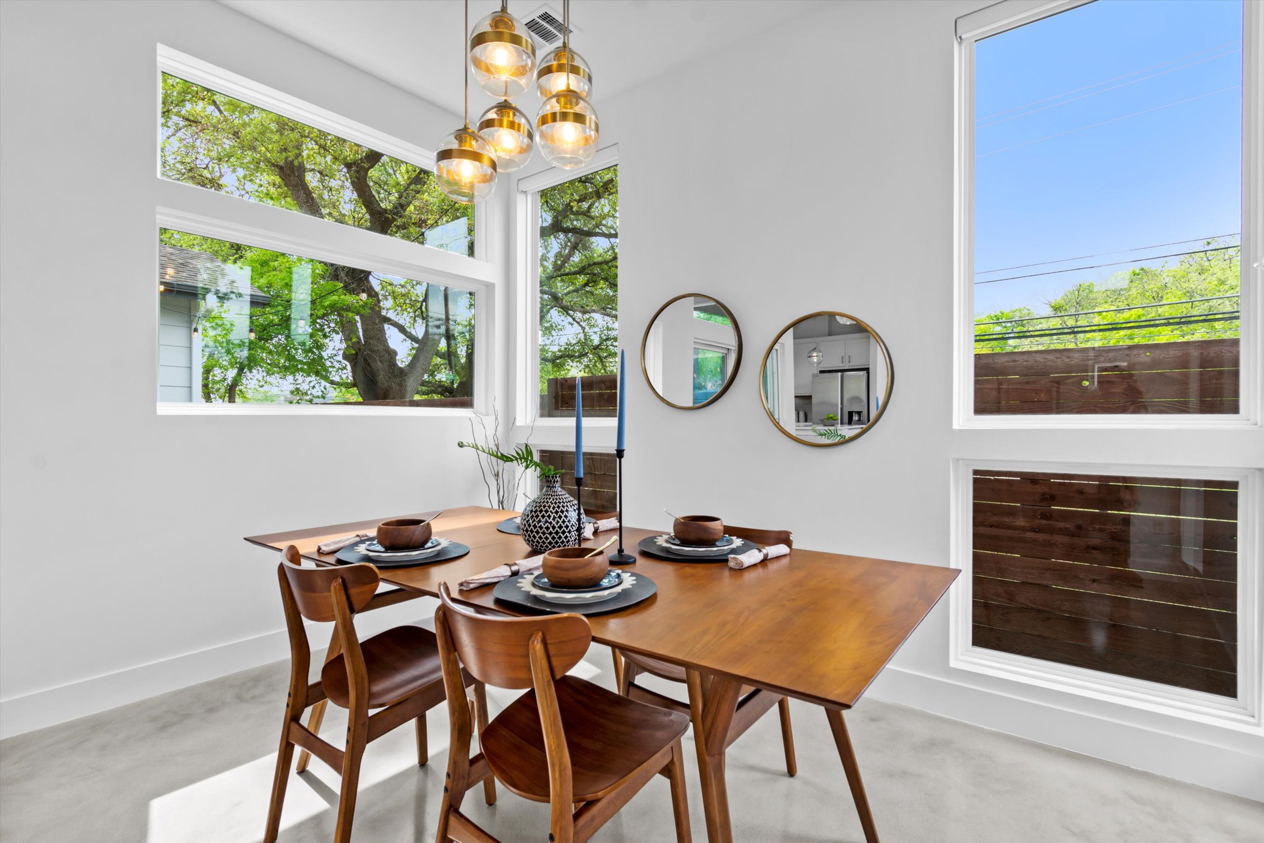 513 West Croslin Street, Unit A Austin, TX 78752 - Photo 7 of 39 a dining room with furniture and a large window