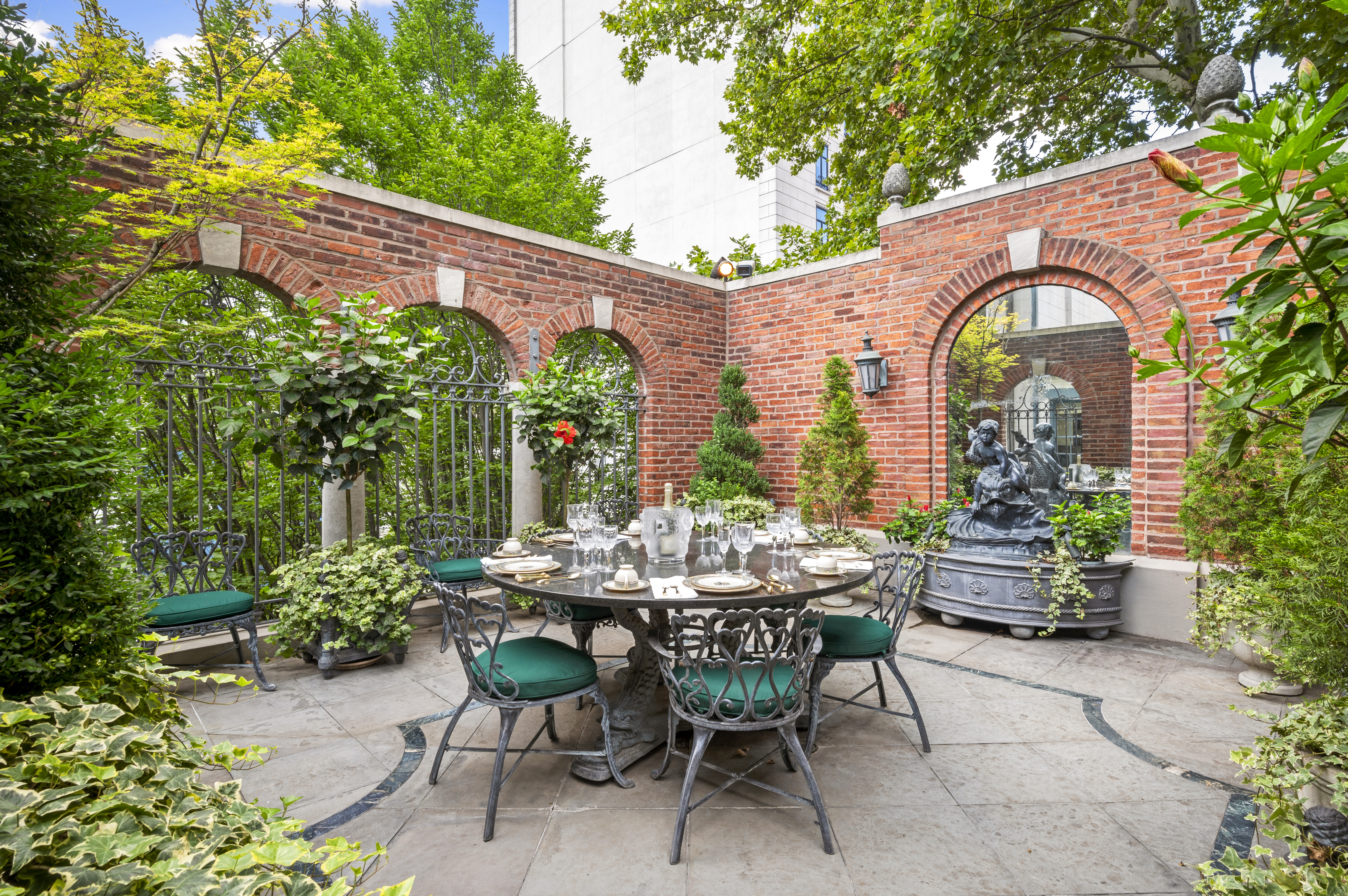 163 East 64th Street Manhattan, NY 10065 - Photo 28 of 34 a view of patio with a table and chairs and potted plants