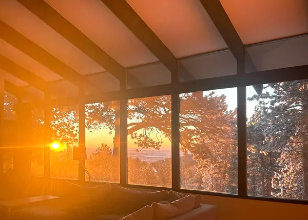 a living room with furniture wooden floor and a fireplace